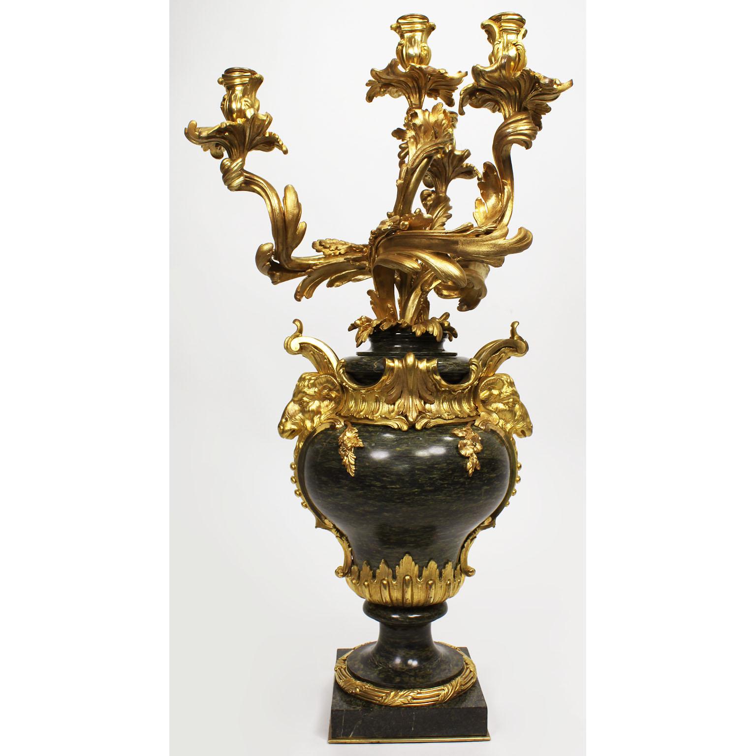 A very fine and palatial pair of French 19th century Louis XV style marble and gilt bronze mounted four-light figural candelabra by Henri Vian, (French, 1860-1905). The ovoid marble urn base surmounted with ormolu mounts of Royal Ram heads, flowers