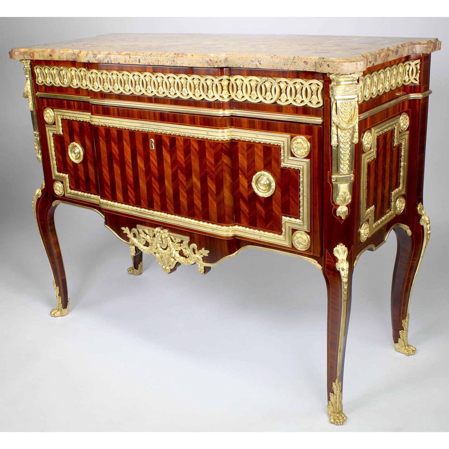 A very fine pair of French 19th/20th century Louis XV/XVI style Transitional Style Satinwood Parquetry and Gilt-Bronze Mounted Commodes with Brêche d'Alep marble-tops, attributed to François Linke (1855-1946), inspired by models by Léonard Boudin