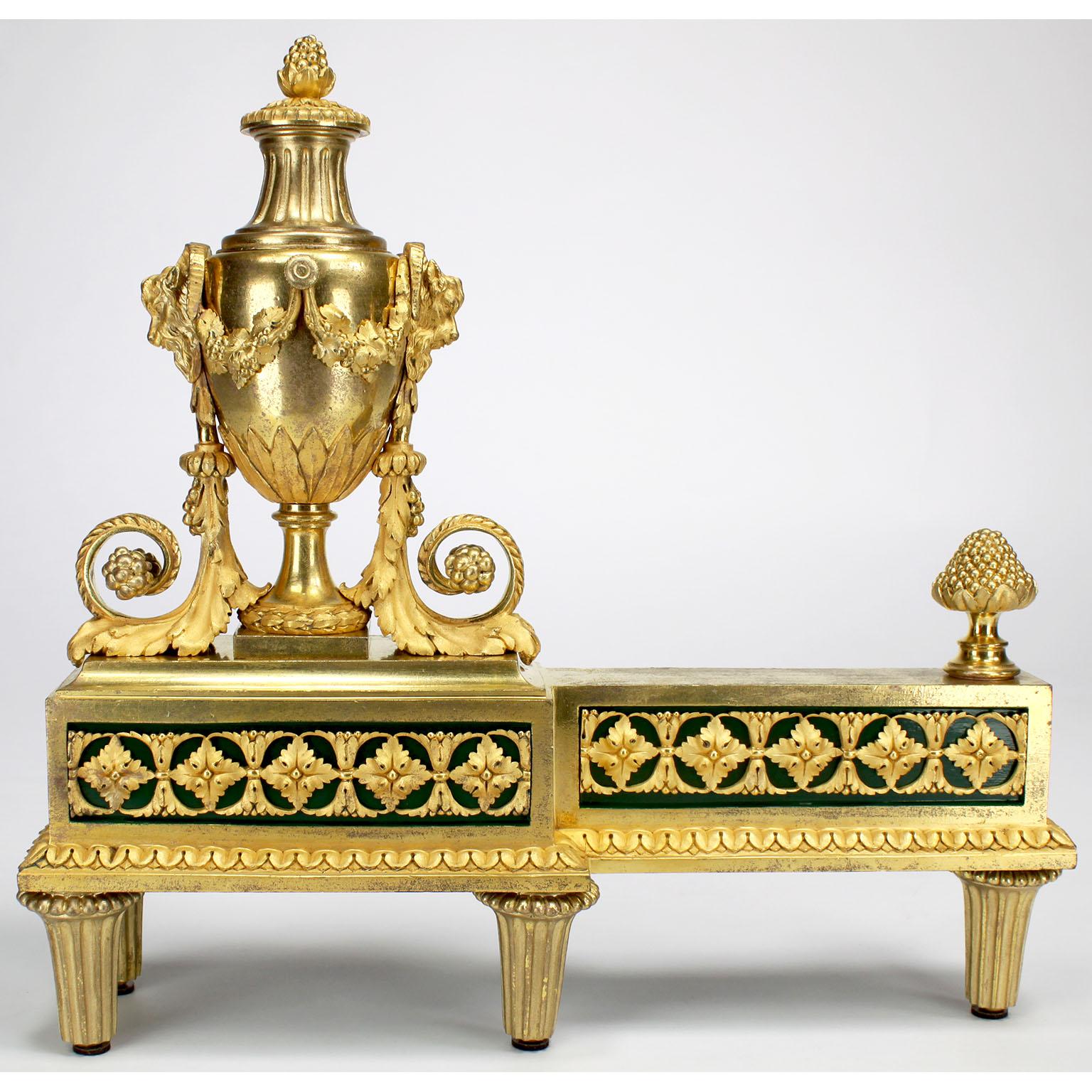 A very fine and rare pair of French 19th century Louis XVI style Ormolu Figural Chenets, by Henry Dasson (French, 1825-1896). The finely chased satin and mercury gilt bronze andirons, each surmounted with an allegorical neoclassical style urn
