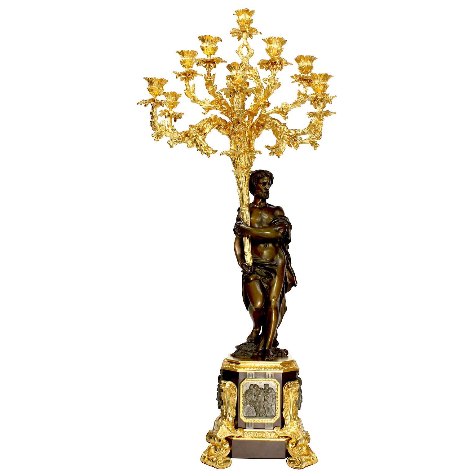 A very fine pair of French 19th century neoclassical Greco-Roman style patinanted bronze and ormolu mounted figural candelabra by Henri Picard (French, Active from 1831-1864). The large and impressive pair of ten-light candelabra, each with a
