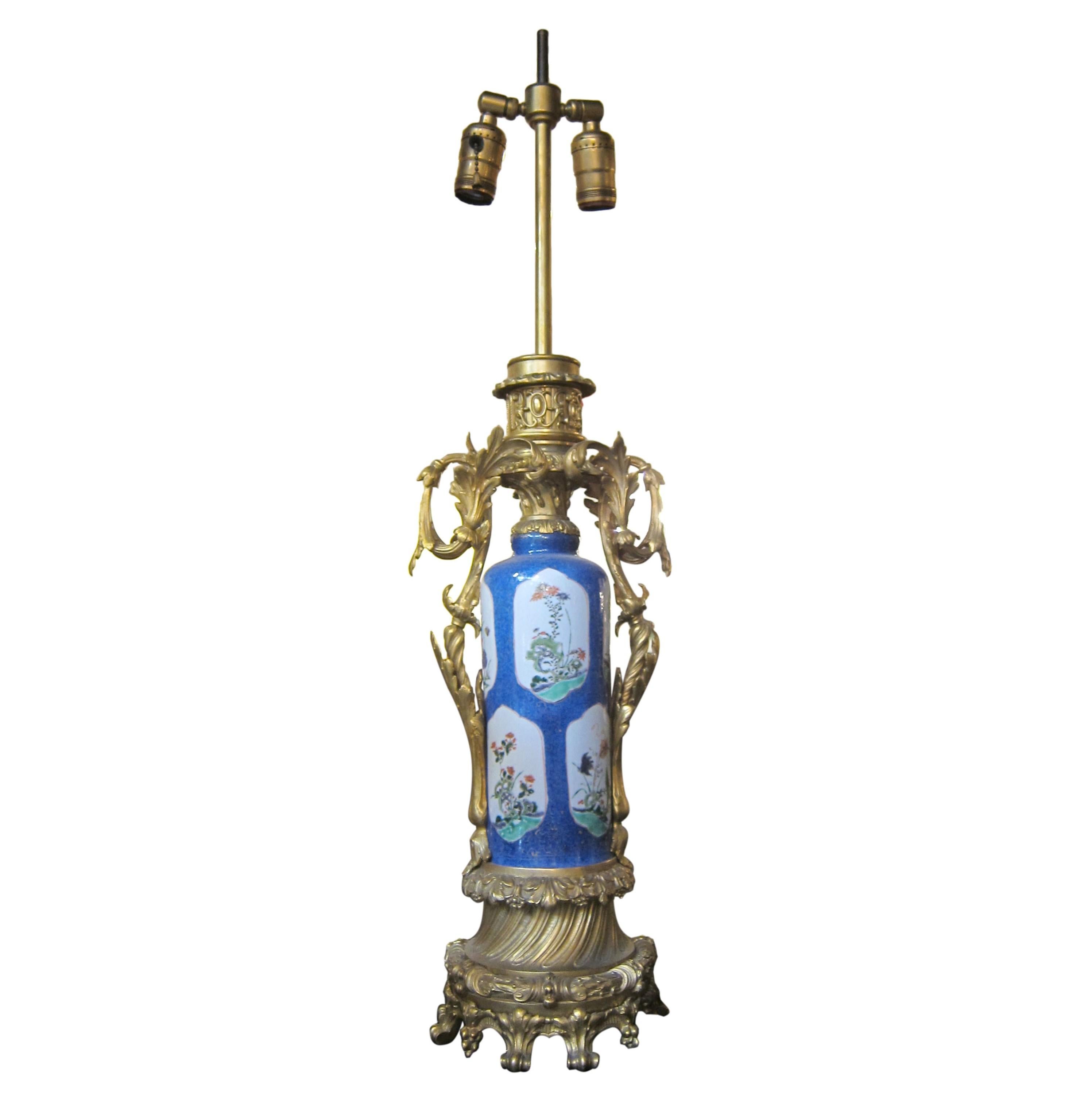 Pair French blue porcelain urn table lamps with finely detailed bronze ormolu mounts. Each light takes two bulbs. Priced as a pair. Cleaned and restored. Please note, this item is located in one of our NYC locations.