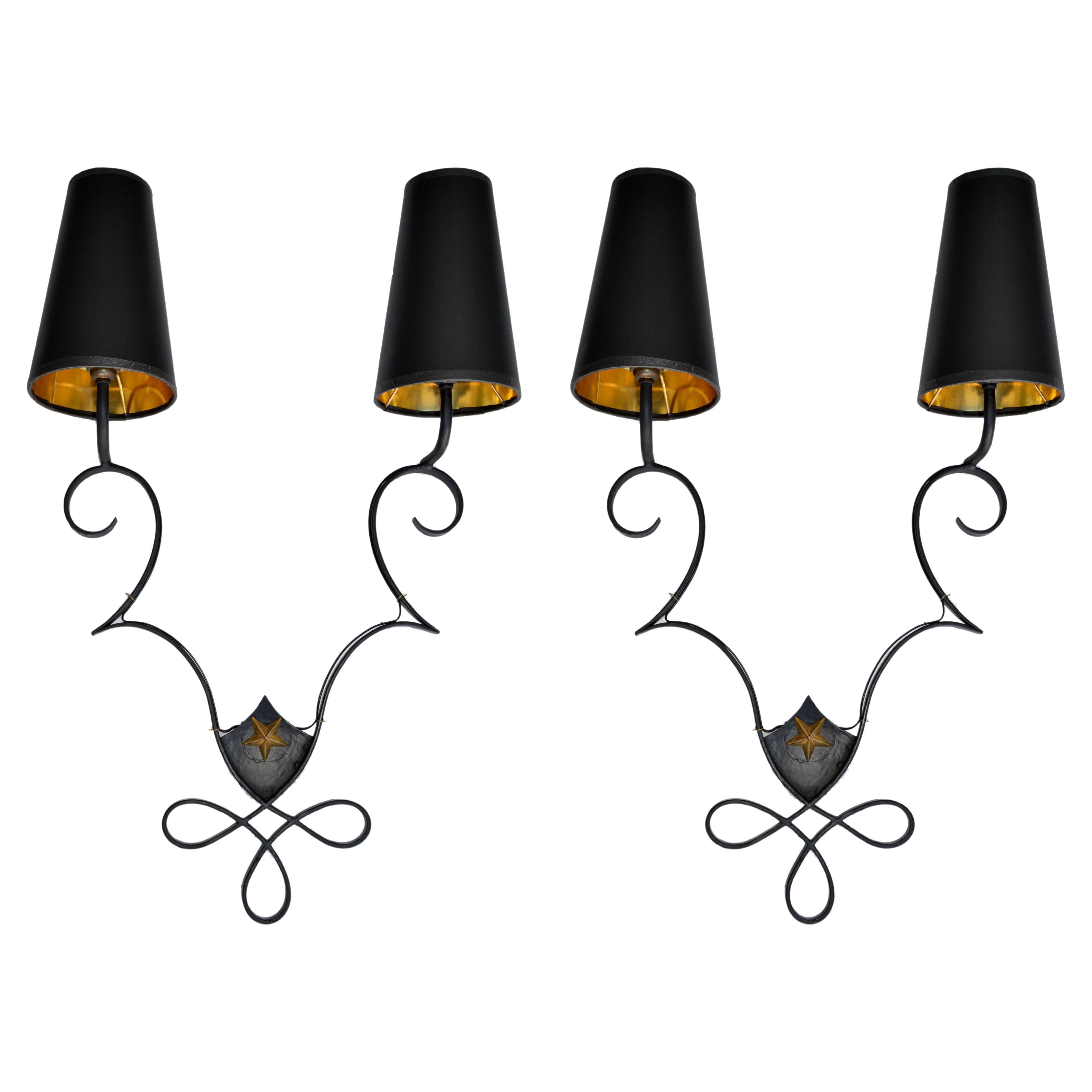 Superb pair of French wrought iron & brass 2 lights wall sconces in the style of Gilbert Poillerat with Black & Gold Paper Cone Shades.
US rewired and in working condition, each Sconces takes 2 candelabra light bulbs with max 60 watts.
Back plate