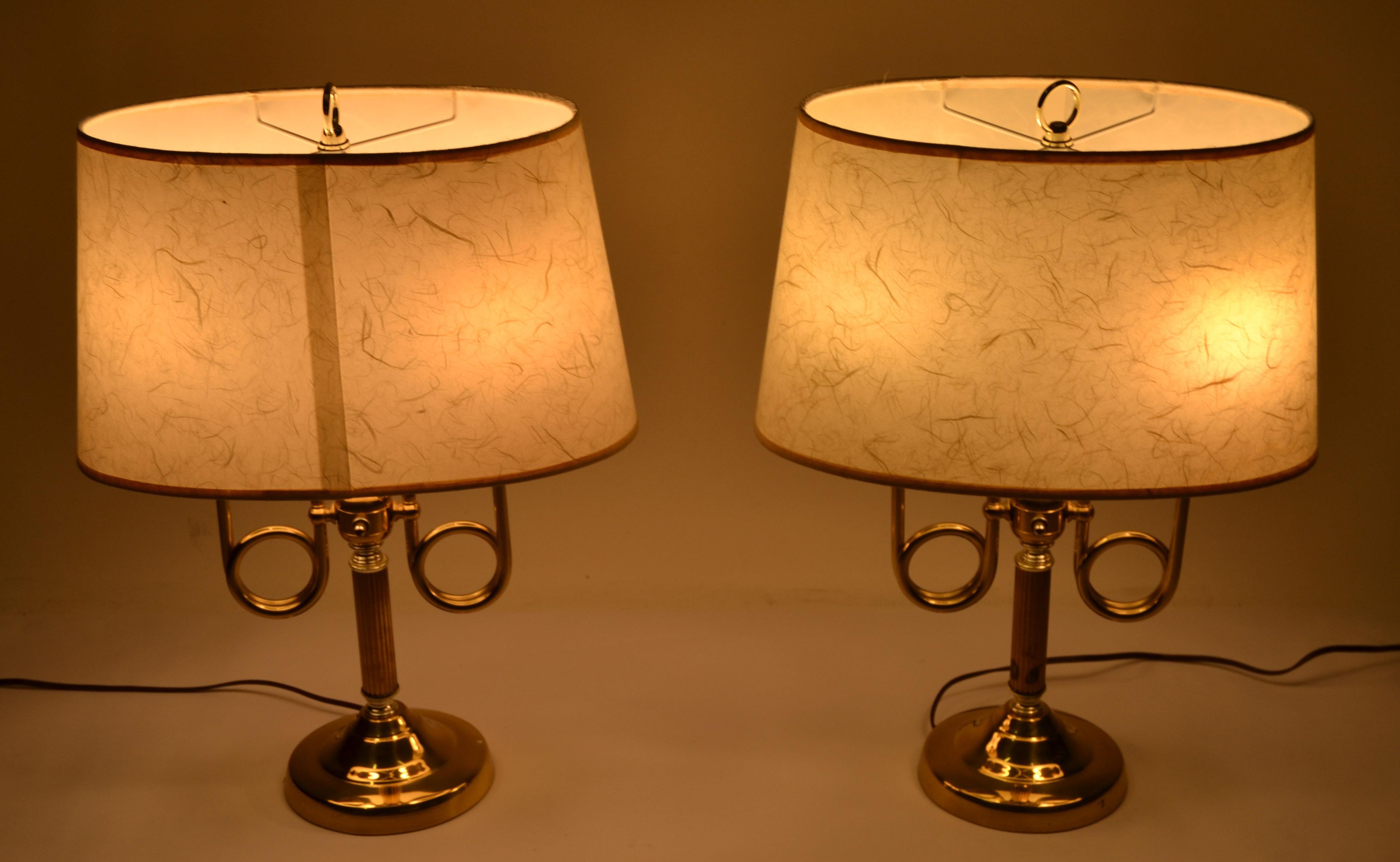 Vintage pair original Alsy solid two patina brass trumpet Bouillotte style, double arm table lamp with oval parchment paper shades.
US Rewiring and each lamp takes 2 light bulbs max. 40 watts.
The original parchment shades have signs of wear, and