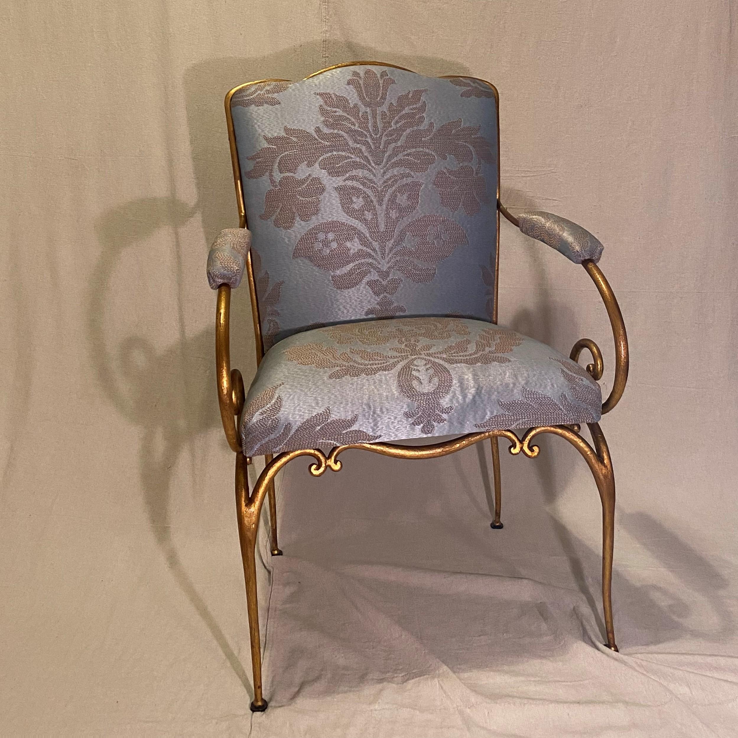 Pair of French Art Deco / Art Modern custom armchairs circa 1940. By designer Rene Drouet. Gold gilded Iron with a silk damask upholstery fabric by Christopher Hyland. Not part of Drouet’s production line of furniture. Purchased originally through
