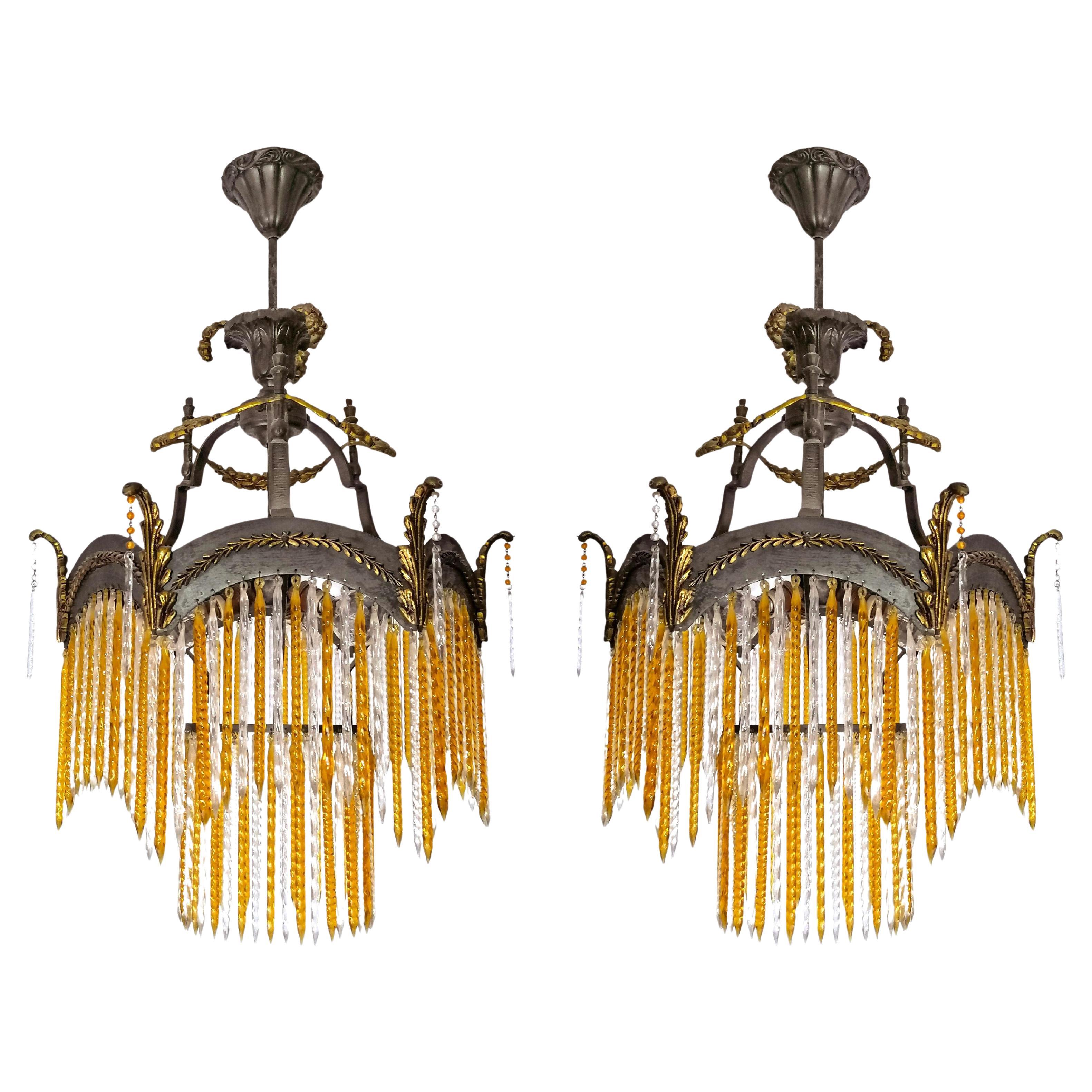 Fabulous  Art Deco or Art Nouveau amber and clear twisted crystal glass fringe and gilt bronze chandelier. Price per unit.
Dimentions:
Diameter 17.72 in/ 45 cm
Height 25.56 in/ 70 cm
Three light bulbs E14/ Good working condition
Assembly required. 