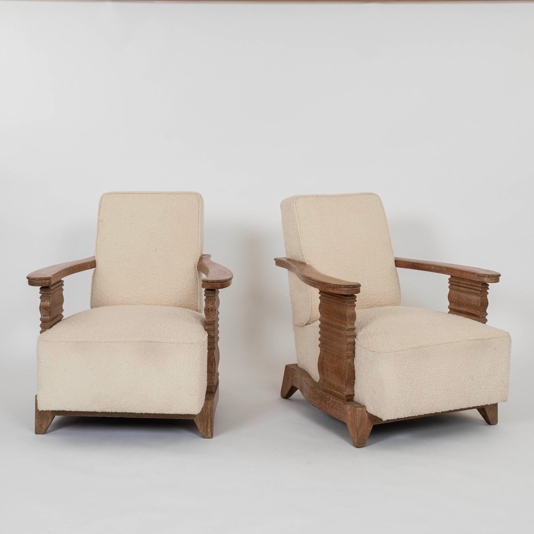 Pair of French Art Deco cereused white oak chairs with reticulated arms and knubby boucle.