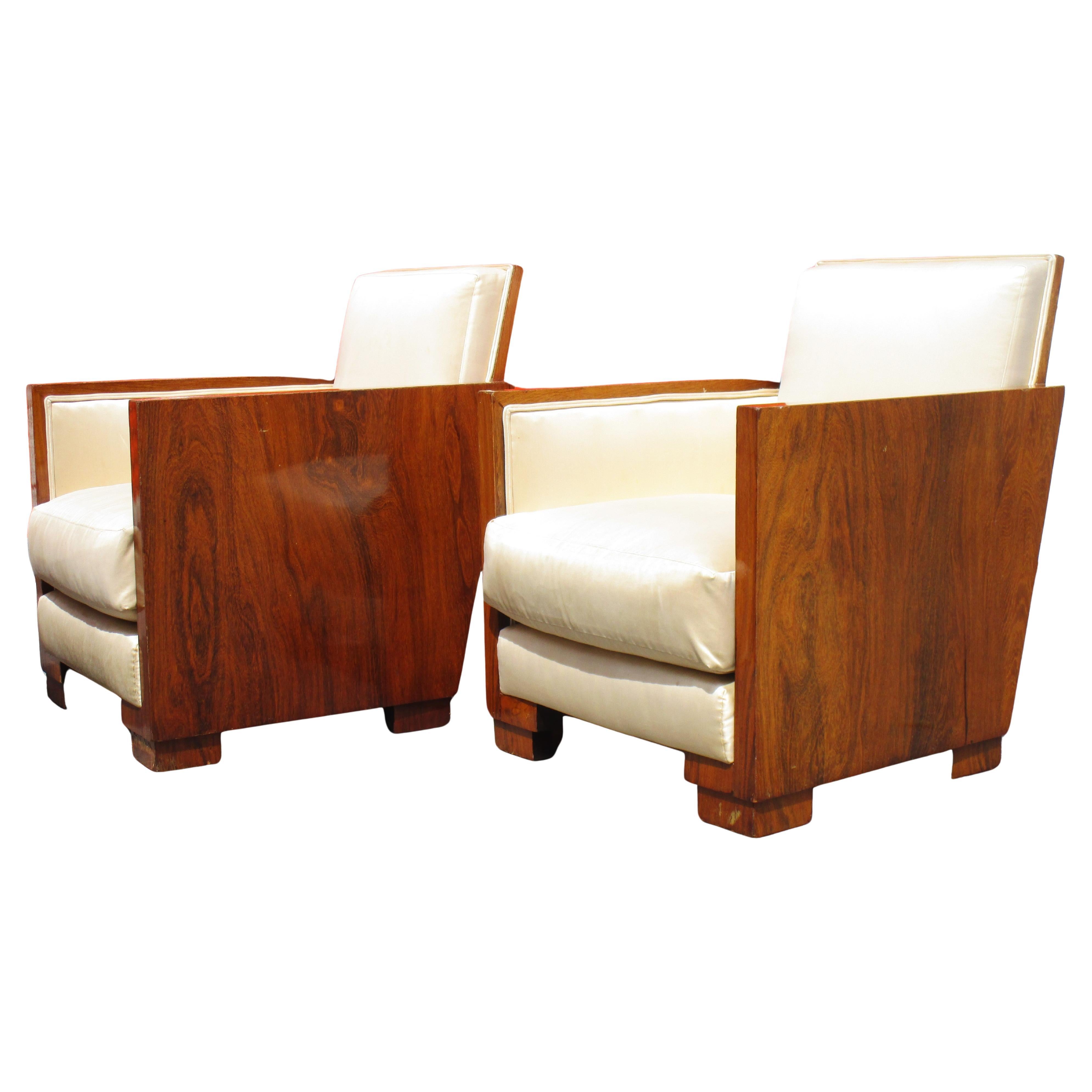 Pair of French Art Deco armchairs with exquisitely proportioned well figured glowing exotic hardwood frames - looks to be rosewood and lush ivory colored silk upholstery. Exceptionally beautiful ( our pictures do not do justice ) Circa 1930. Look at