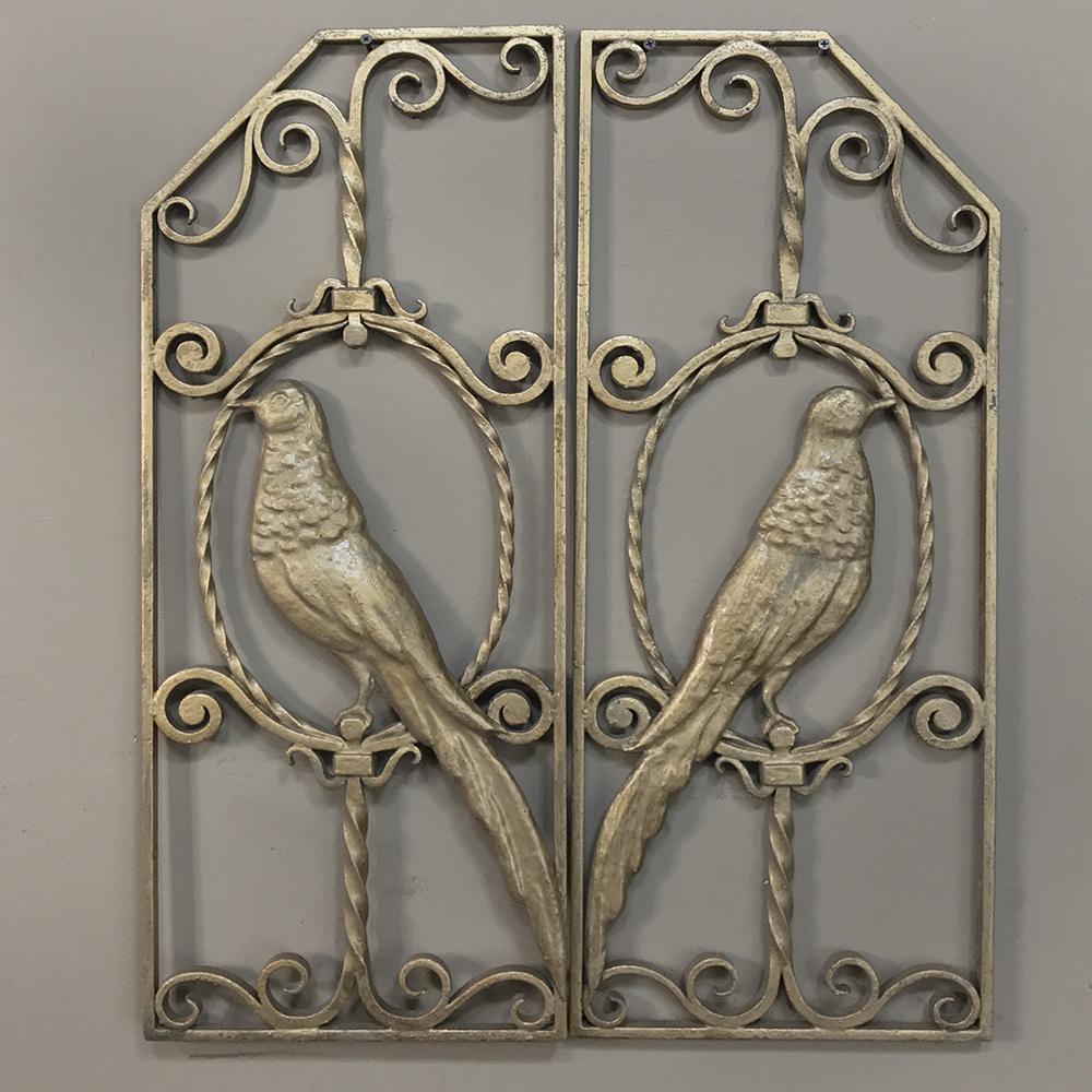 Pair French Art Deco gilded wrought iron gates are ideal for a quaint courtyard or interior accent, and feature an avian theme,
circa 1930s
Measure: 28 H x 23 W (Each 11.5W).
