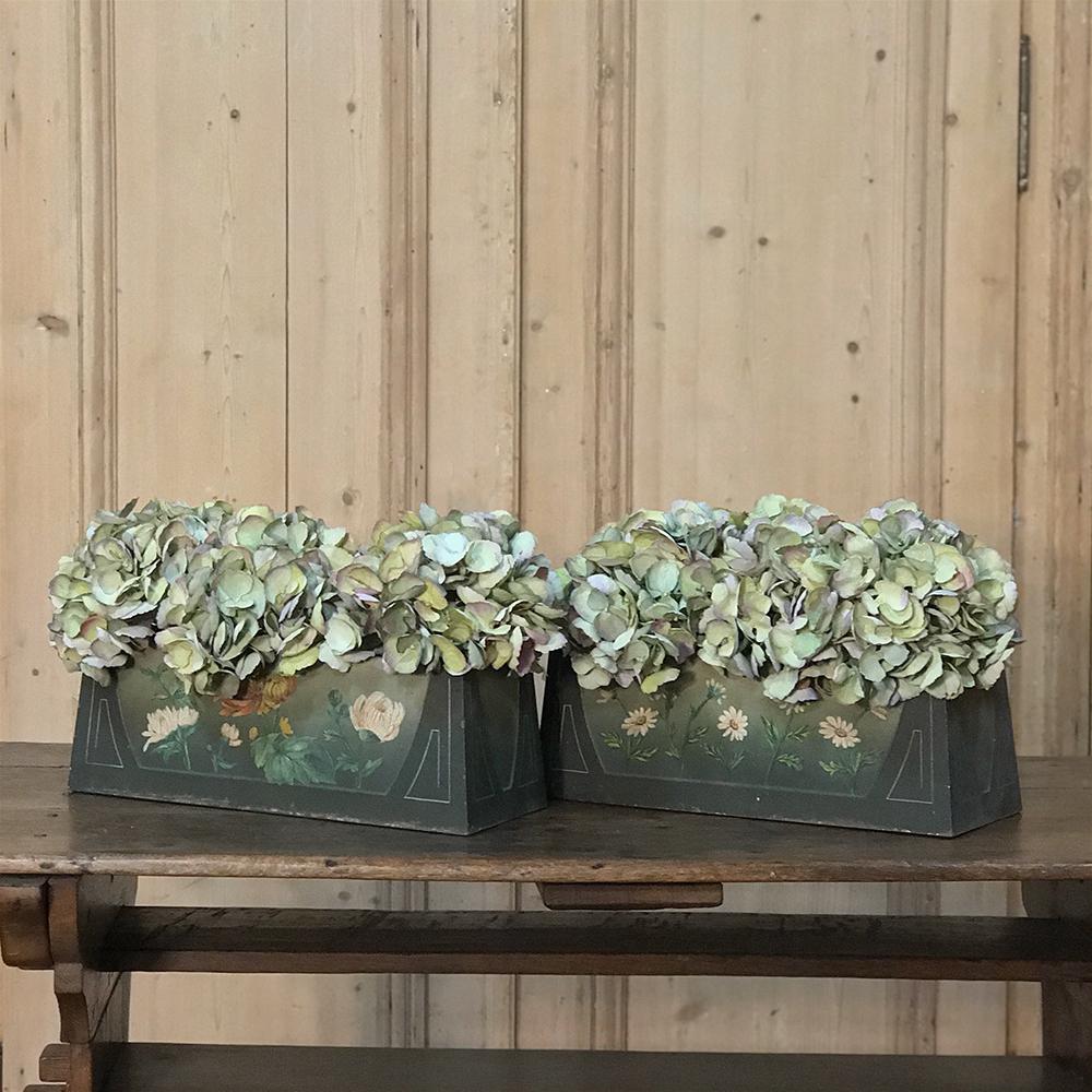 Charming pair of French Art Deco period painted jardinières / planter boxes, boasting original painted finish and tin liners,
circa 1930s.
Each measures: 6 H x 16 W x 6.5 D.