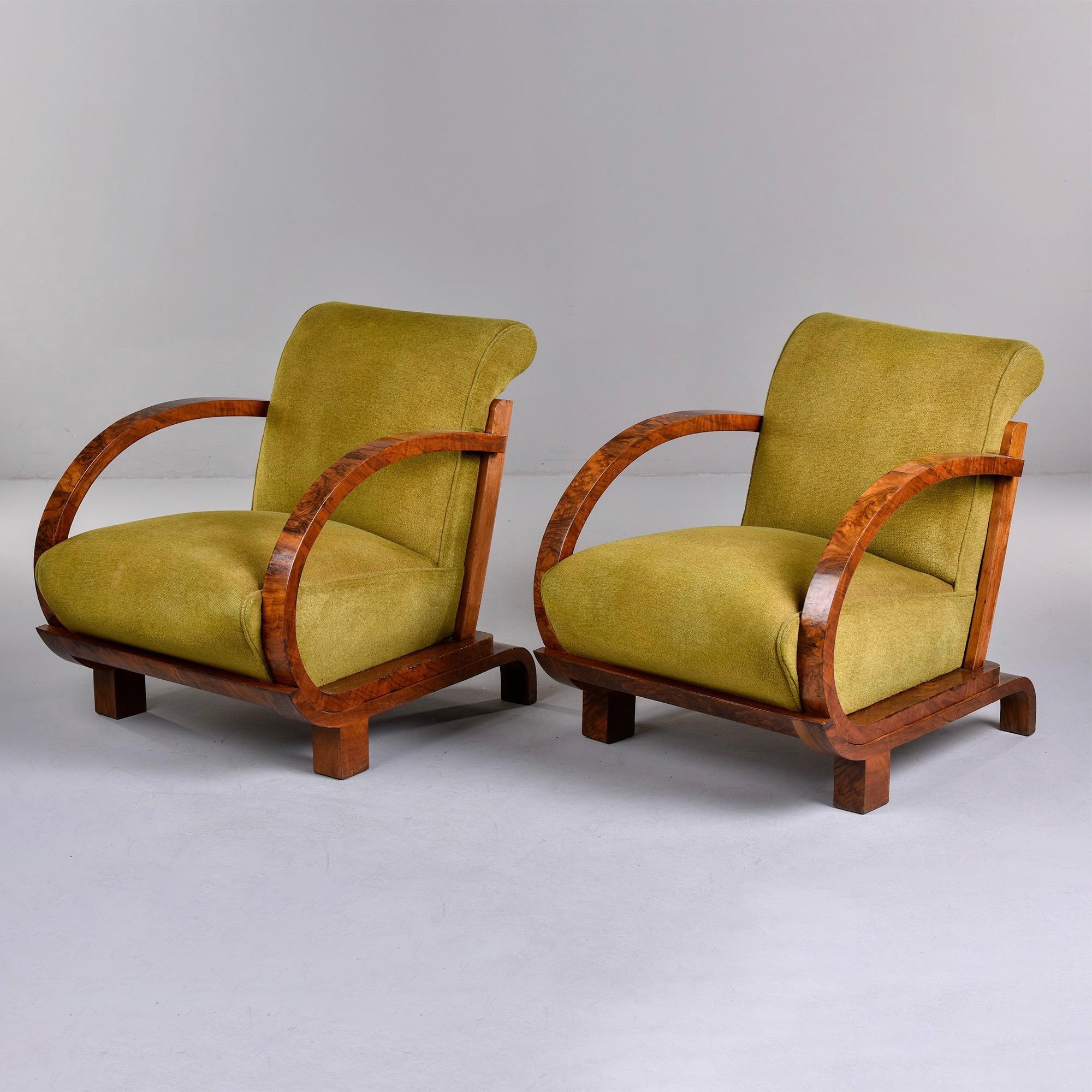 Circa 1930s French Art Deco armchairs have curvy bentwood arms and the frames are finished with burlwood veneer. Upholstered seat and back is a single removable piece. Chairs are covered in what we believe is the original mohair upholstery.