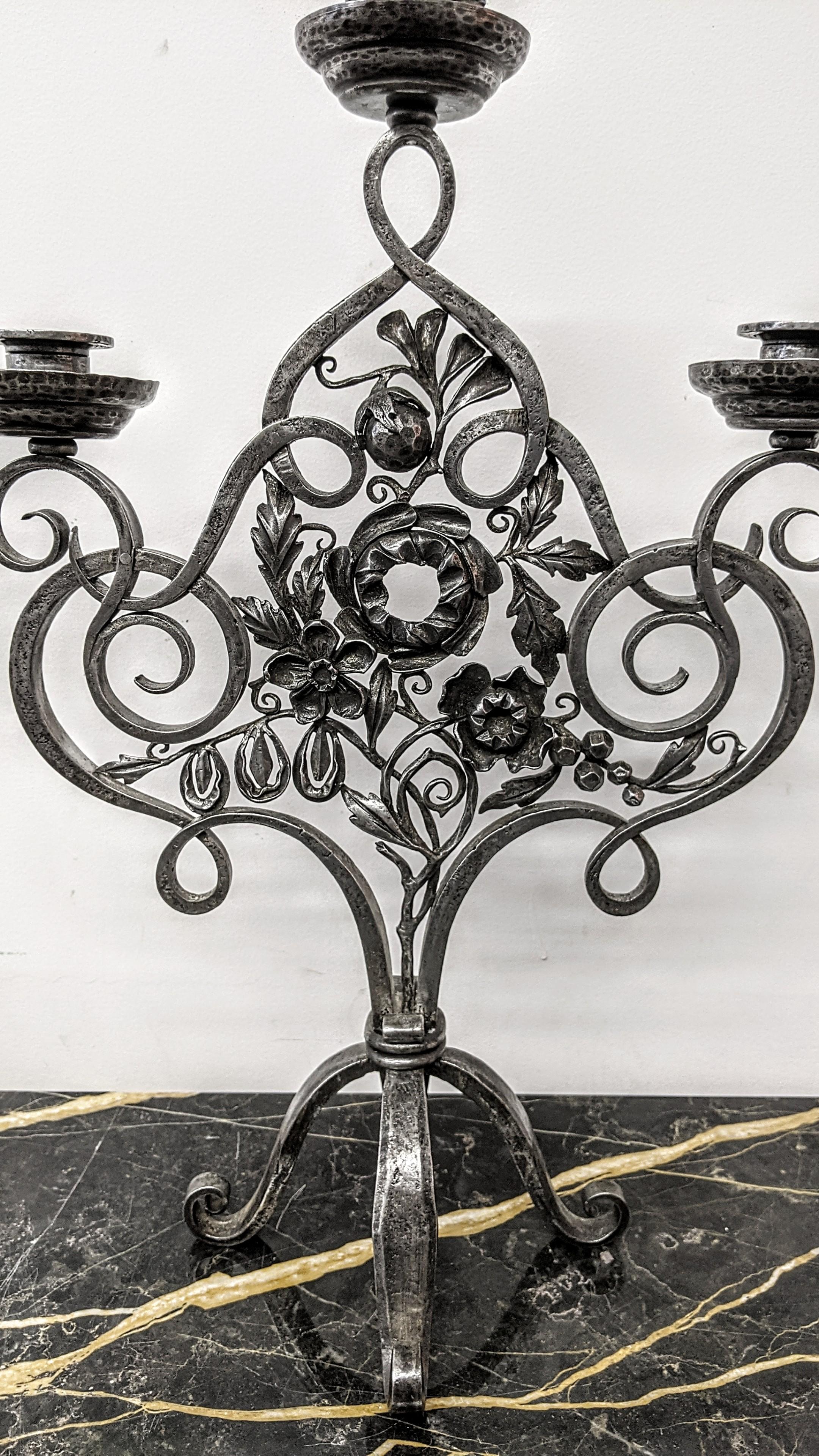A stunning pair of French Art Deco hand forged wrought iron Candle Sticks by Edgar Brandt in great condition. Distinctively designed with extraordinary details in superb condition, circa 1920's. Dimensions: Height: 19.5 in. Width: 14 in. Depth: 8