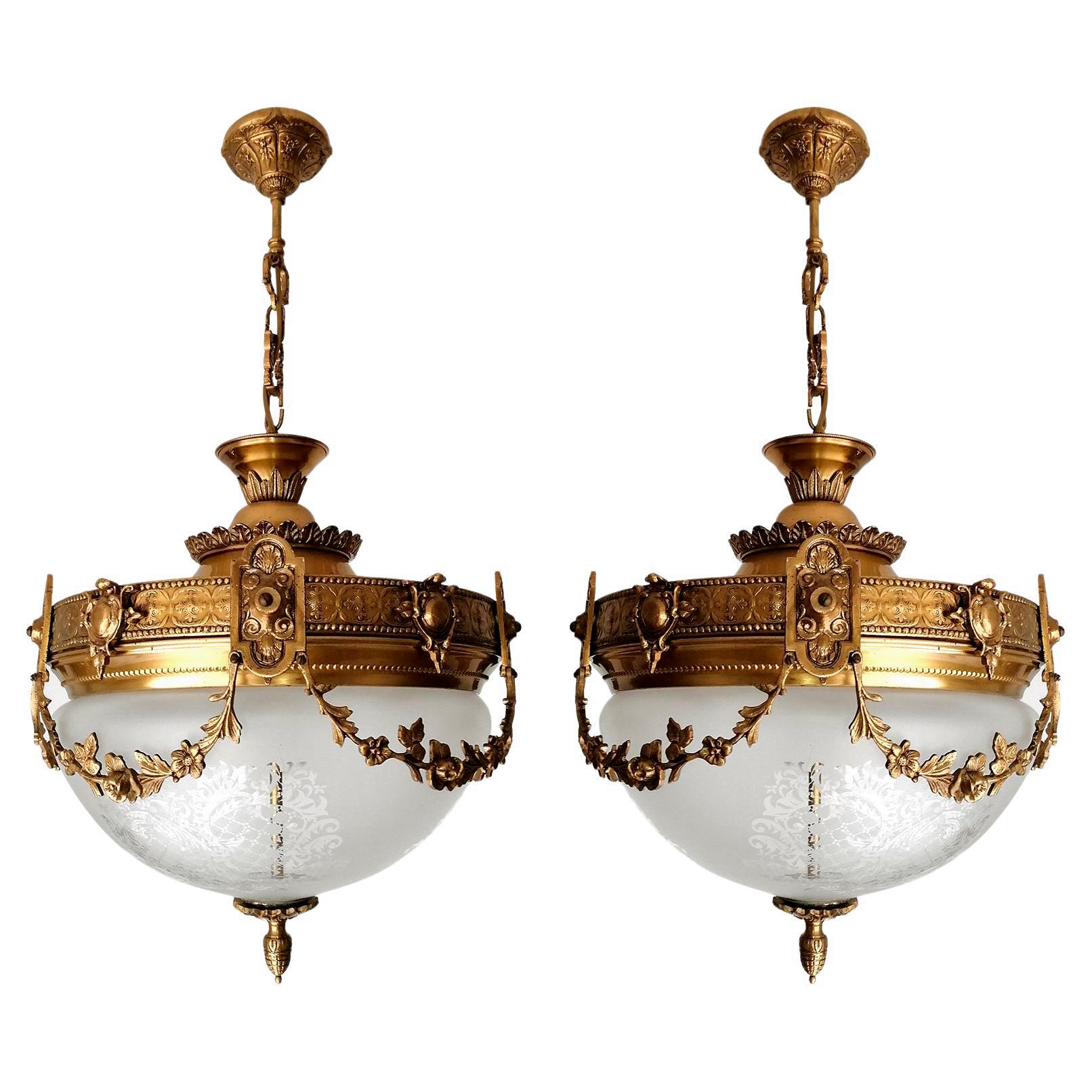 A pair of wonderful gilt bronze and etched-glass two-light ceiling fixture decorated with Fine ornaments and garlands, France, early 20th century.
In very good condition - original etched-glass shades without damages, bronze with beautiful