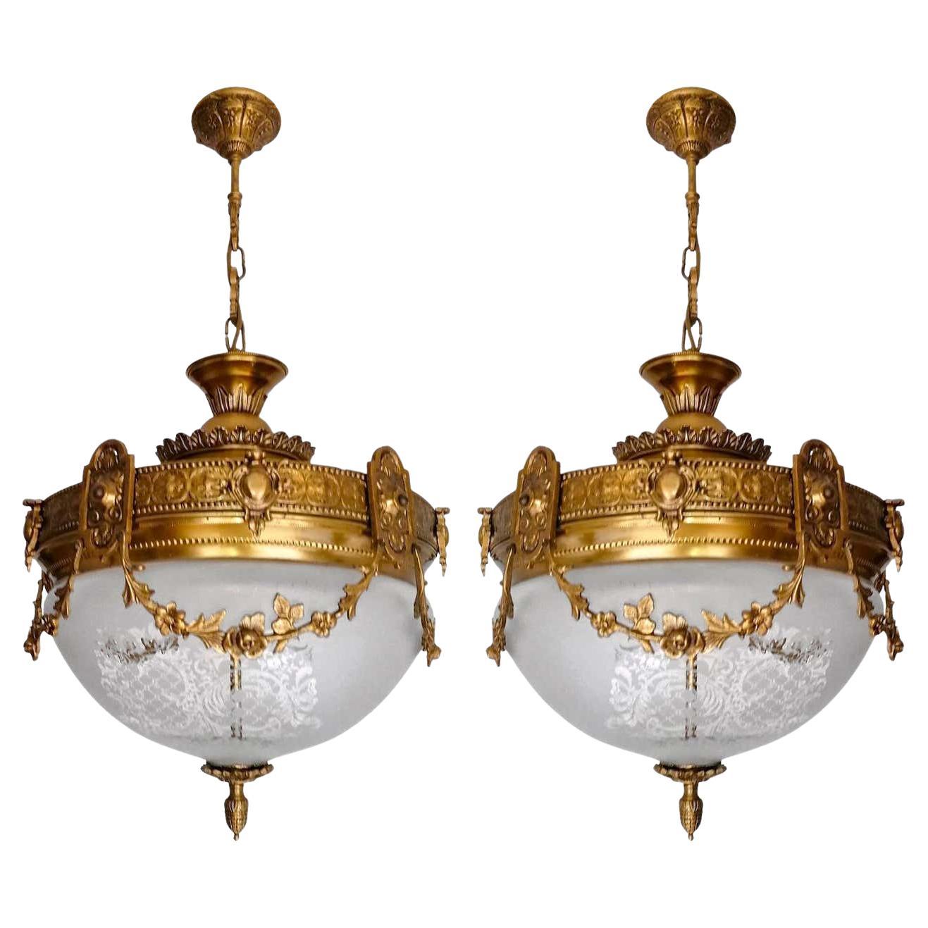 A pair of wonderful gilt bronze and etched-glass two-light ceiling fixture decorated with Fine ornaments and garlands, France, early 20th century.
In very good condition - original etched-glass shades without damages, bronze with beautiful