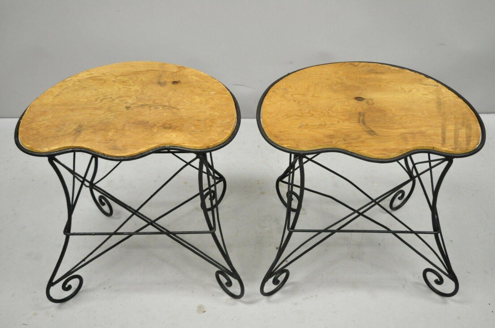Pair of French Art Nouveau style stool bench seats with scrolling wrought iron frame, early 20th century. Measurements: 19