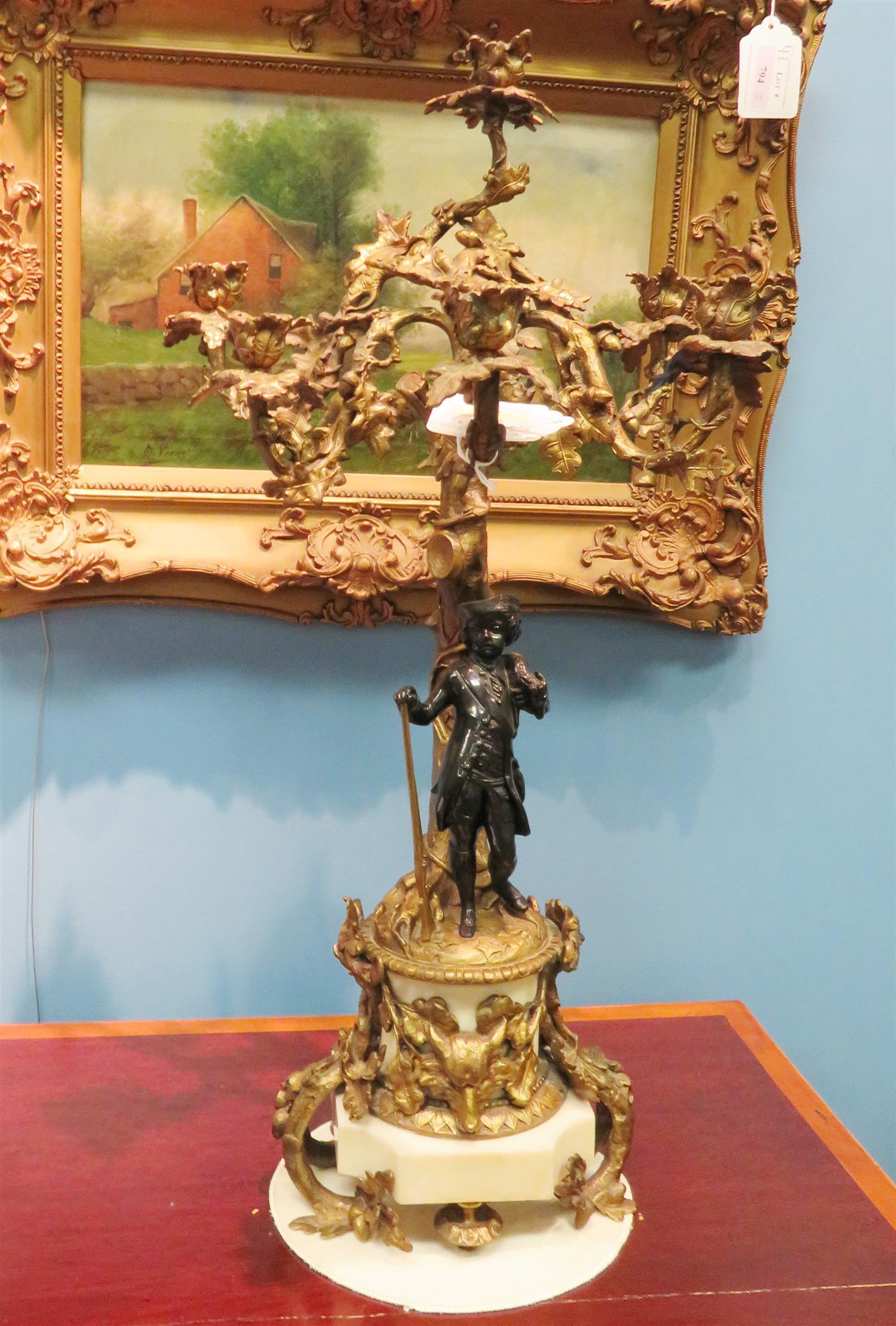 Pair French Bronze and Marble Six-Light Candelabras, 19th Century.  In the manner of Henri Picard (French, fl. 1831-1864) hunting couple stand in front of tree adorned with candle sockets, the marble base with ornate mounts including fox mask