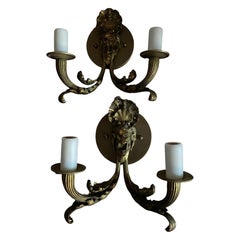 Coppia di applique francesi in bronzo raffiguranti Bacco