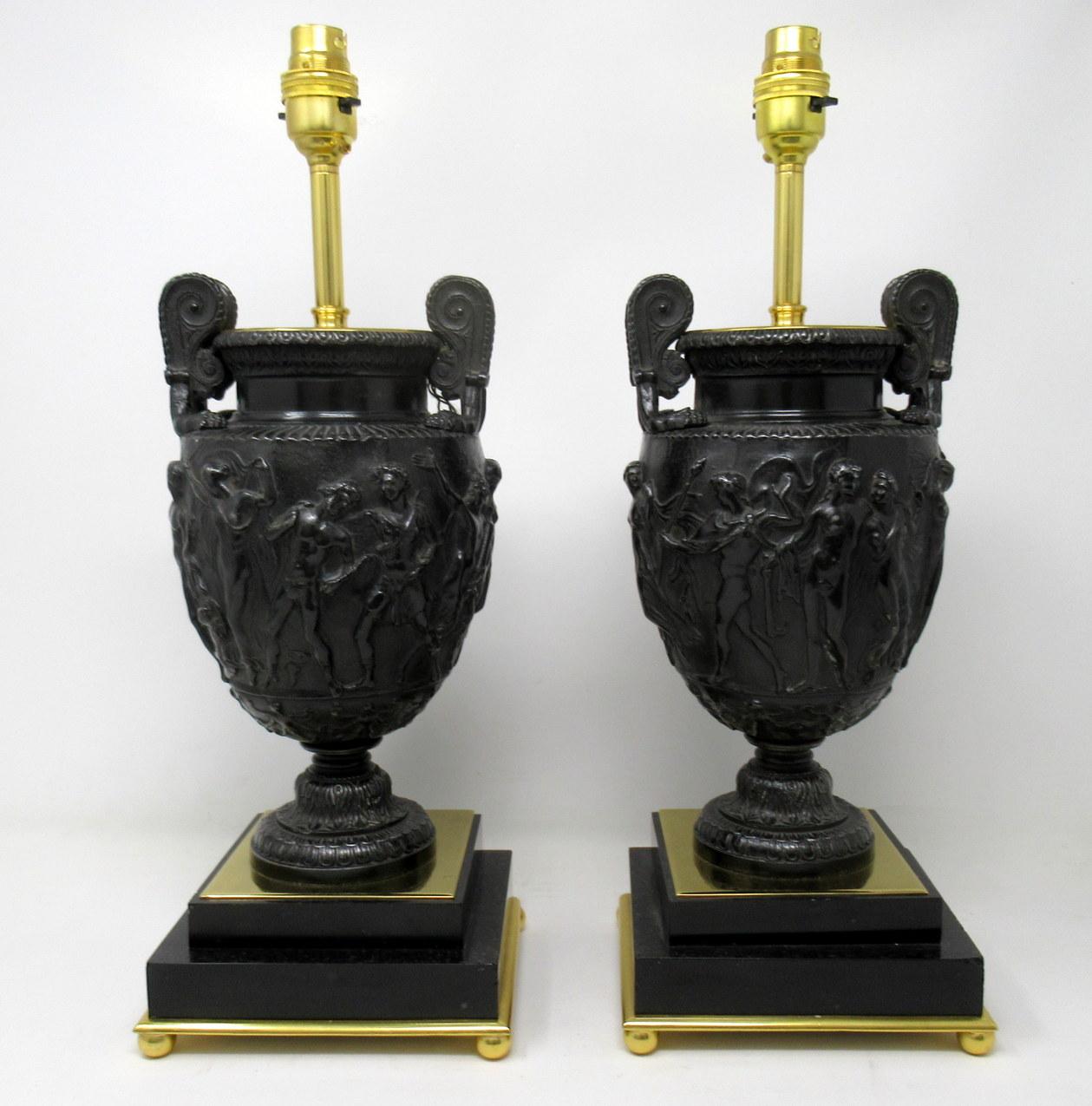 Stunning pair of French heavy Gauge patinated bronzed, marble and ormolu electric table lamps of Good Size proportions. The main central support is a model of the Townley Vase with ormolu mounts ending on a plain square stepped black marble base,
