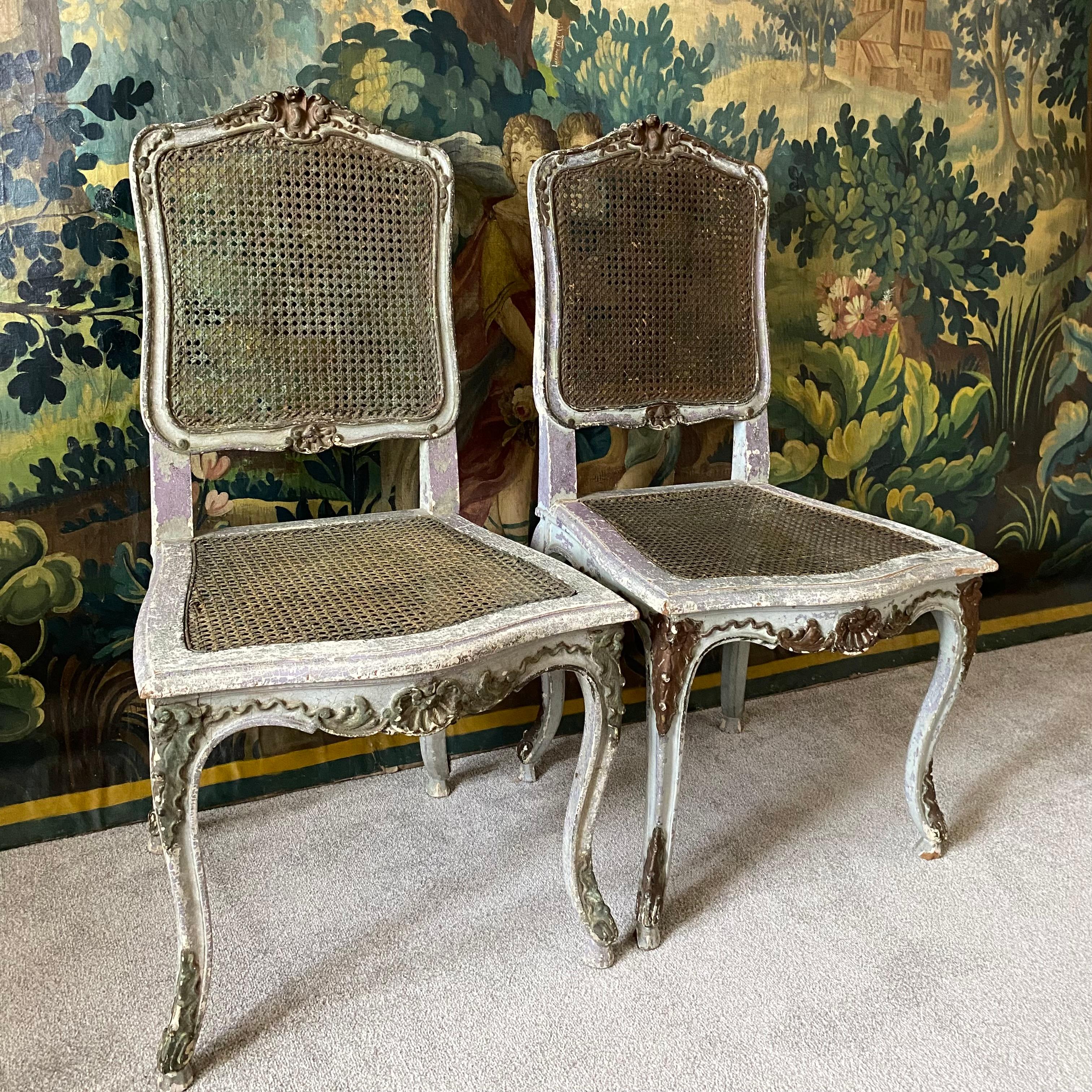 A pair of late 19th century French side chairs with seats and backs with their original cane - this is in good condition with no wear or damage but please note these are decorative side or bedroom chairs and are not for suitable for heavy use - with