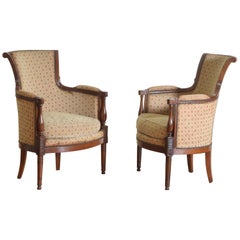 Pair of French Carved Walnut Directoire Upholstered Bergères, Early 19th Century