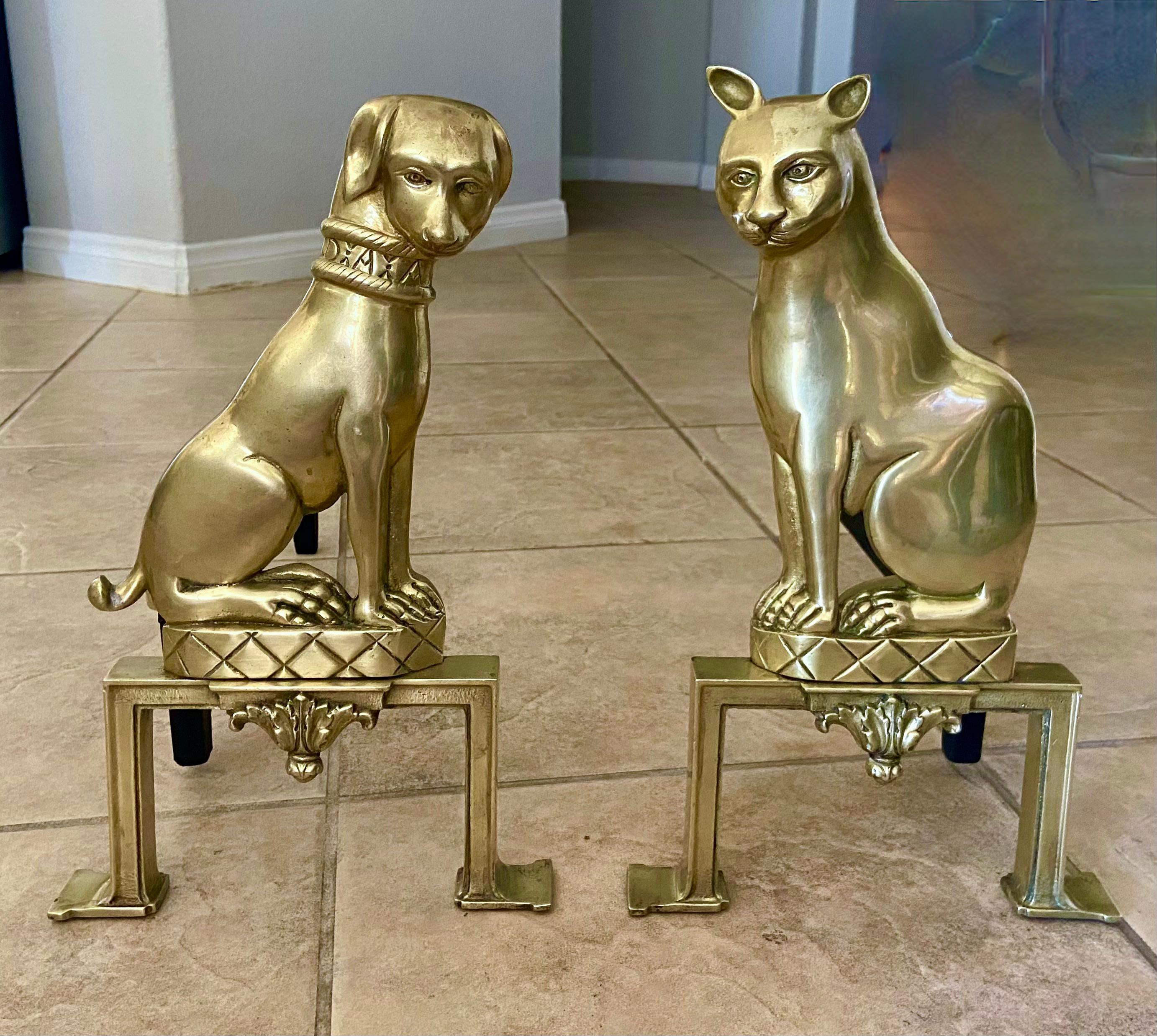 Pair of 19th century French solid brass dog and cat fireplace andirons or chenets. Expertly crafted with fine detailing throughout. It's very rare (if not impossible) to find another pair available. I've seen some later recast examples, but lack the