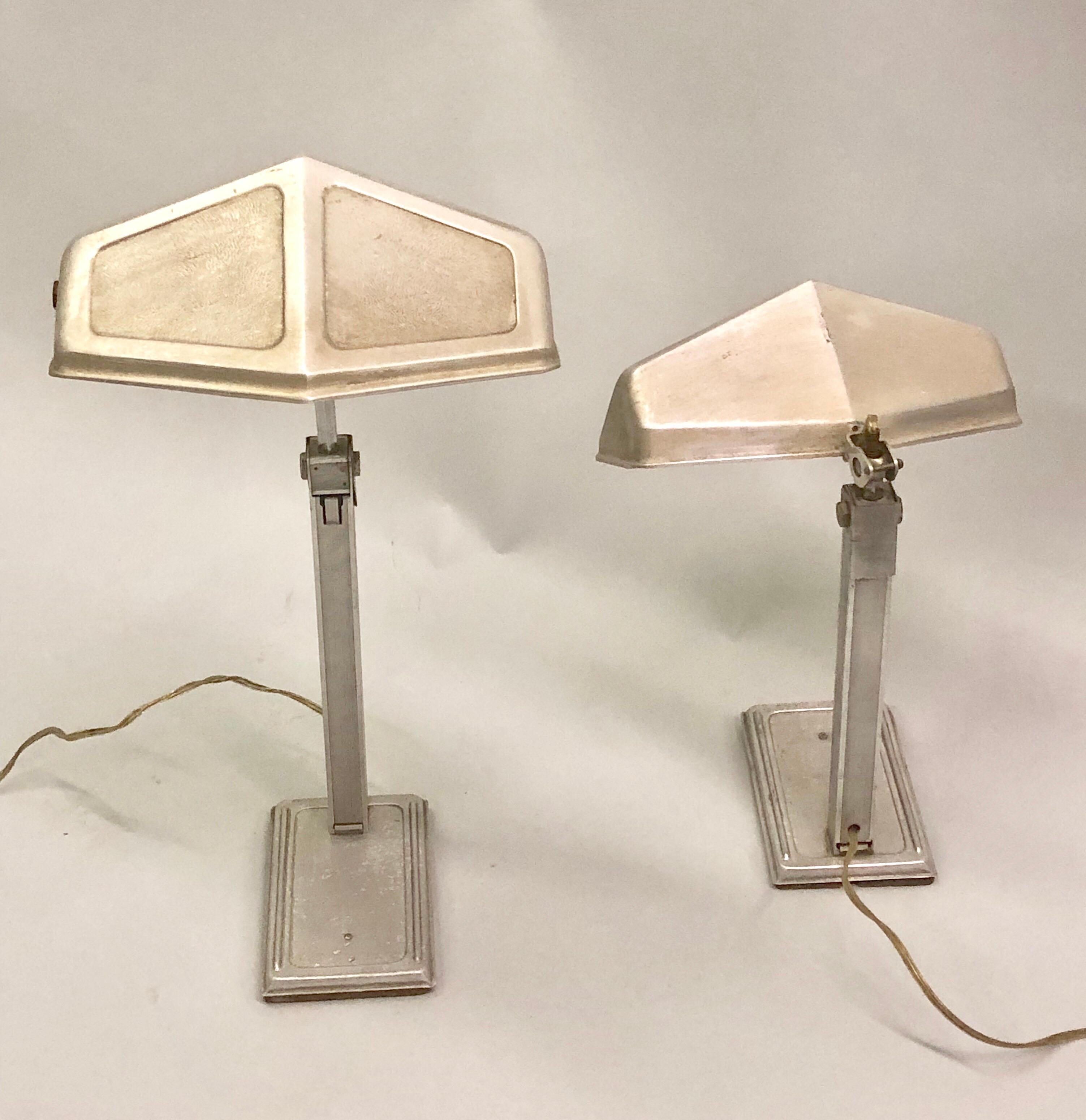 Two French early modern desk or table lamps in aluminum with movable and adjustable diffusers by Pirette. 

The pieces show the influence of Modern, Industrial and French Art Deco Design. The diffusers orient up and down and to each side allowing