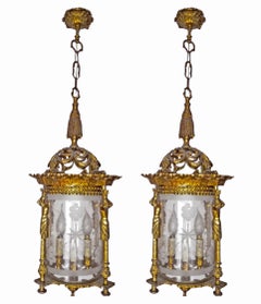 Paar französische Empire-Caryatids-Kronleuchter aus vergoldetem, geschliffenem Bronzeschliffglas mit 4 Lichtern