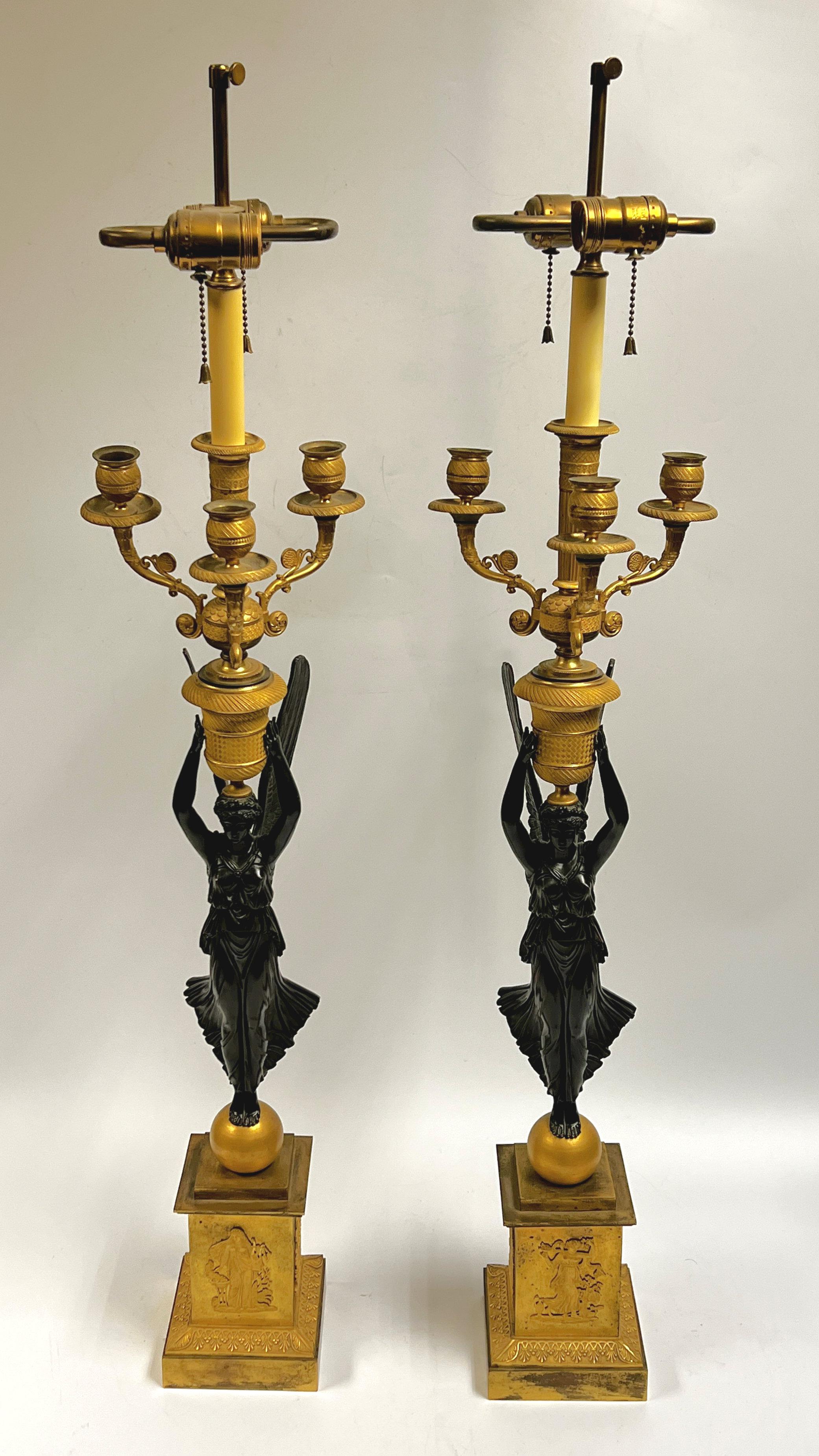 Pair of early 19 century French Empire Gilt and Patinated Bronze figural candelabras made to Table Lamps.