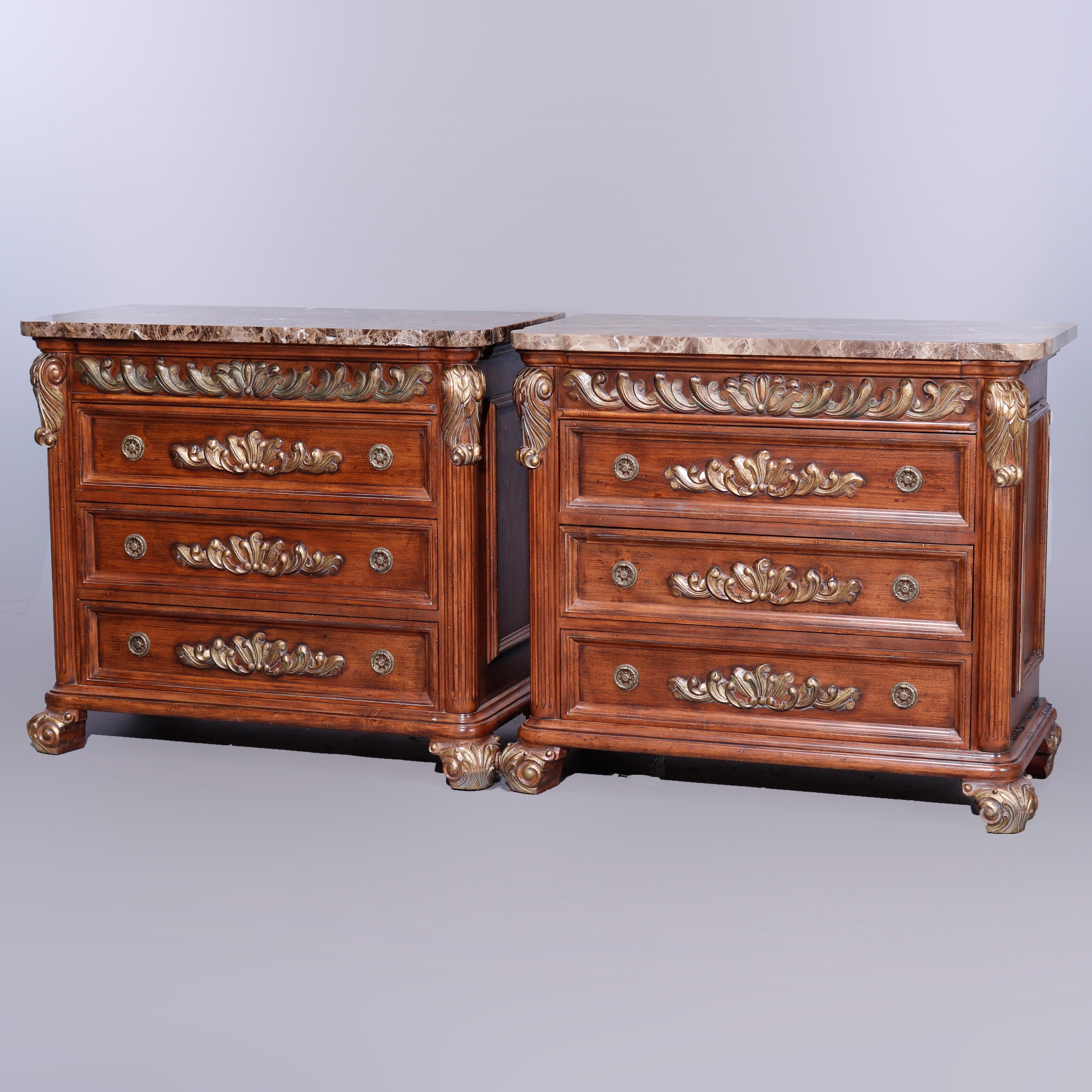 A matching pair of French Empire style commodes by Jeffco offer shaped marble tops surmounting mahogany case having three long drawers, flanking Corinthian column supports with carved and gilt acanthus capitals, and raised on scroll form feet,