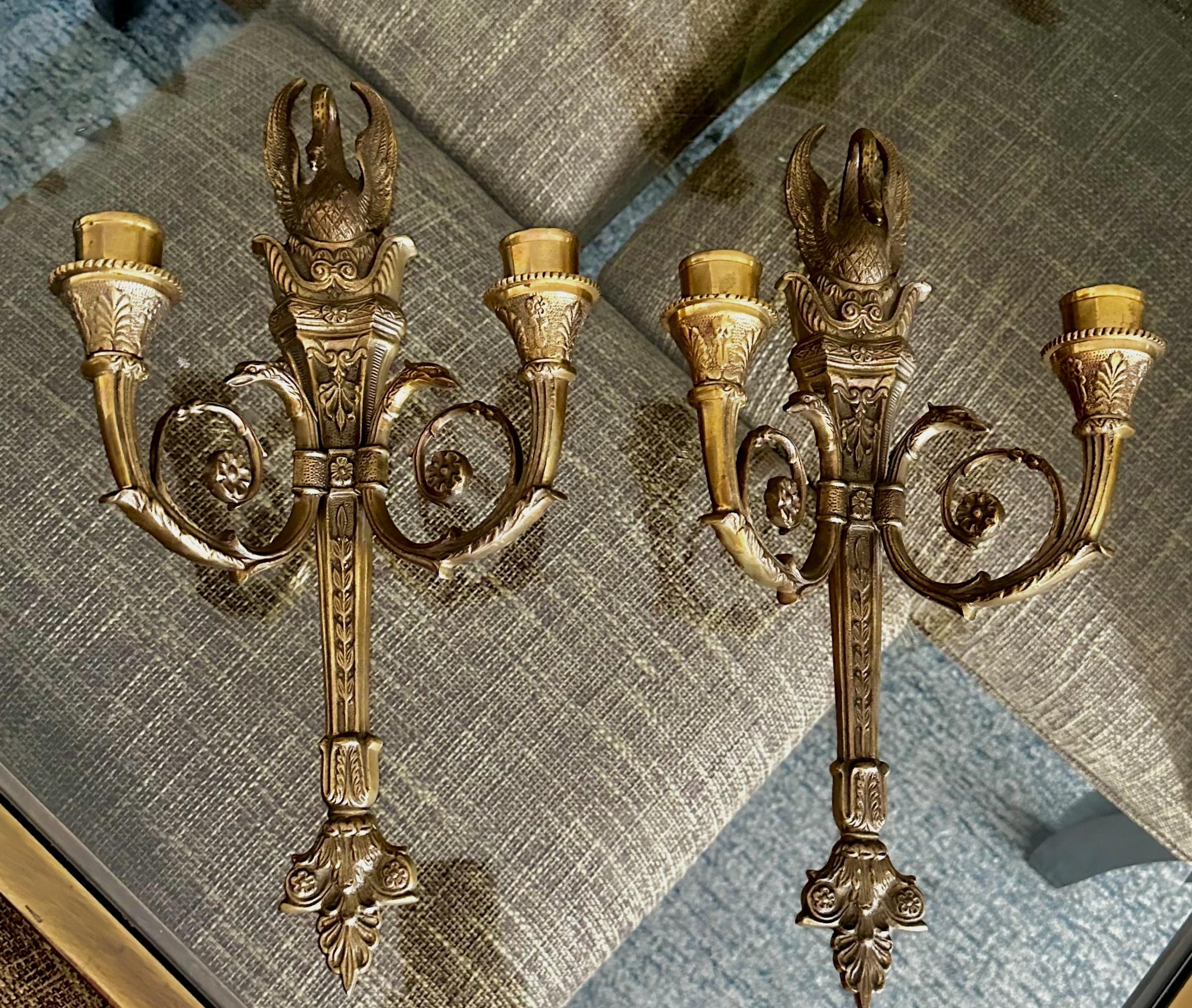 Pair of French Empire style bronze or brass candle wall sconces with swan and serpent motif. Expertly executed with fine detailing throughout. Not electrified uses candles only. 
