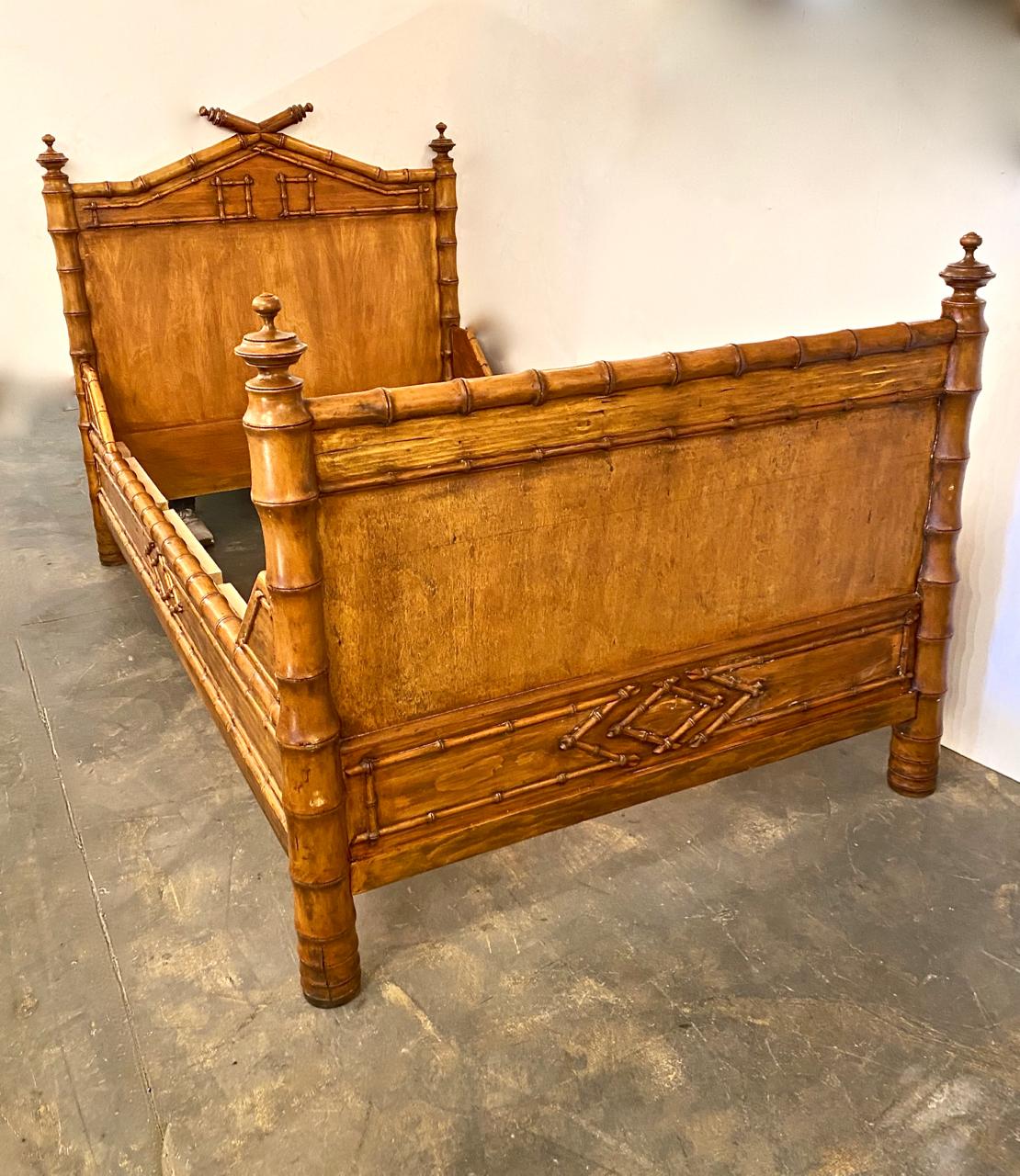This is a superb pair of late 19th-early 20th century faux bamboo beds that retain all of their original elements. Pairs of these very desirable faux bamboo beds are unusual, especially in this condition.