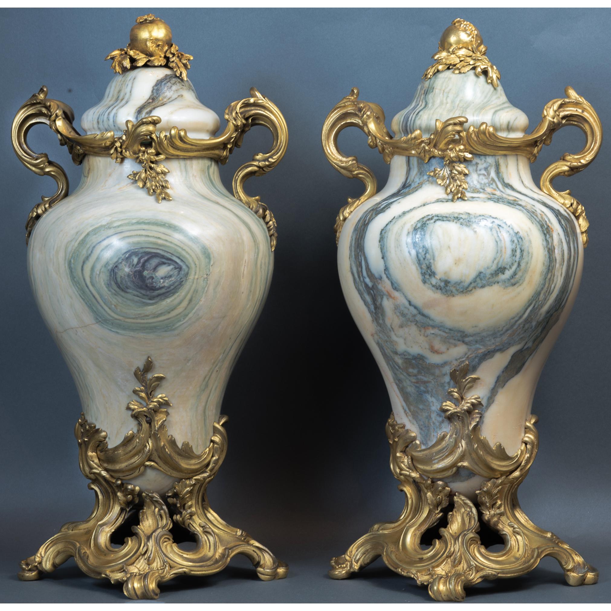 French gilt bronze-mounted Verde marble Urns decorated with open Pomegranate and foliage ornamentation. 

Date: Late 19th C

Dimensions: 8.6 x 21.

