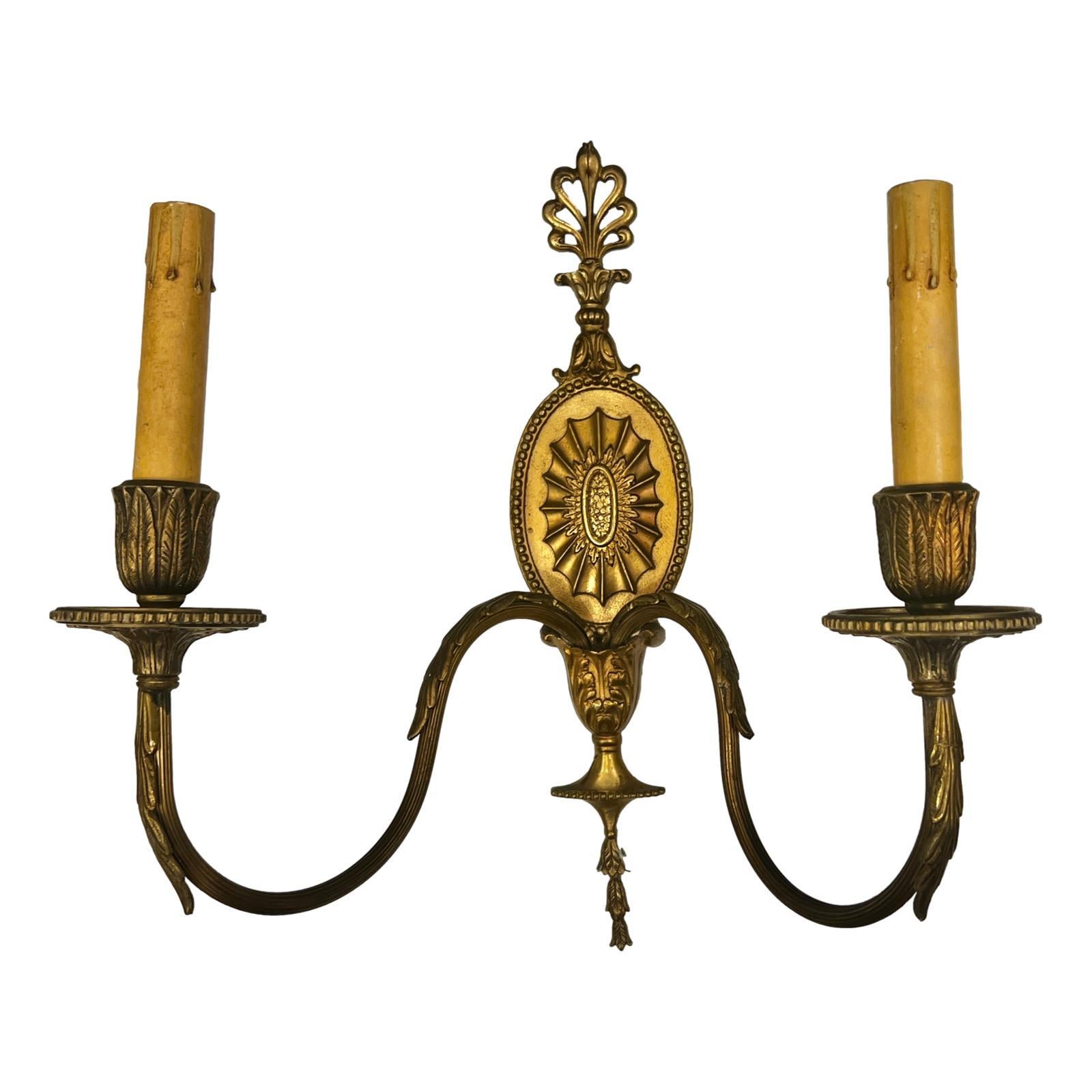 Pair of circa 1920's French neoclassic style two-arm sconces.

Measurements:
Height: 15