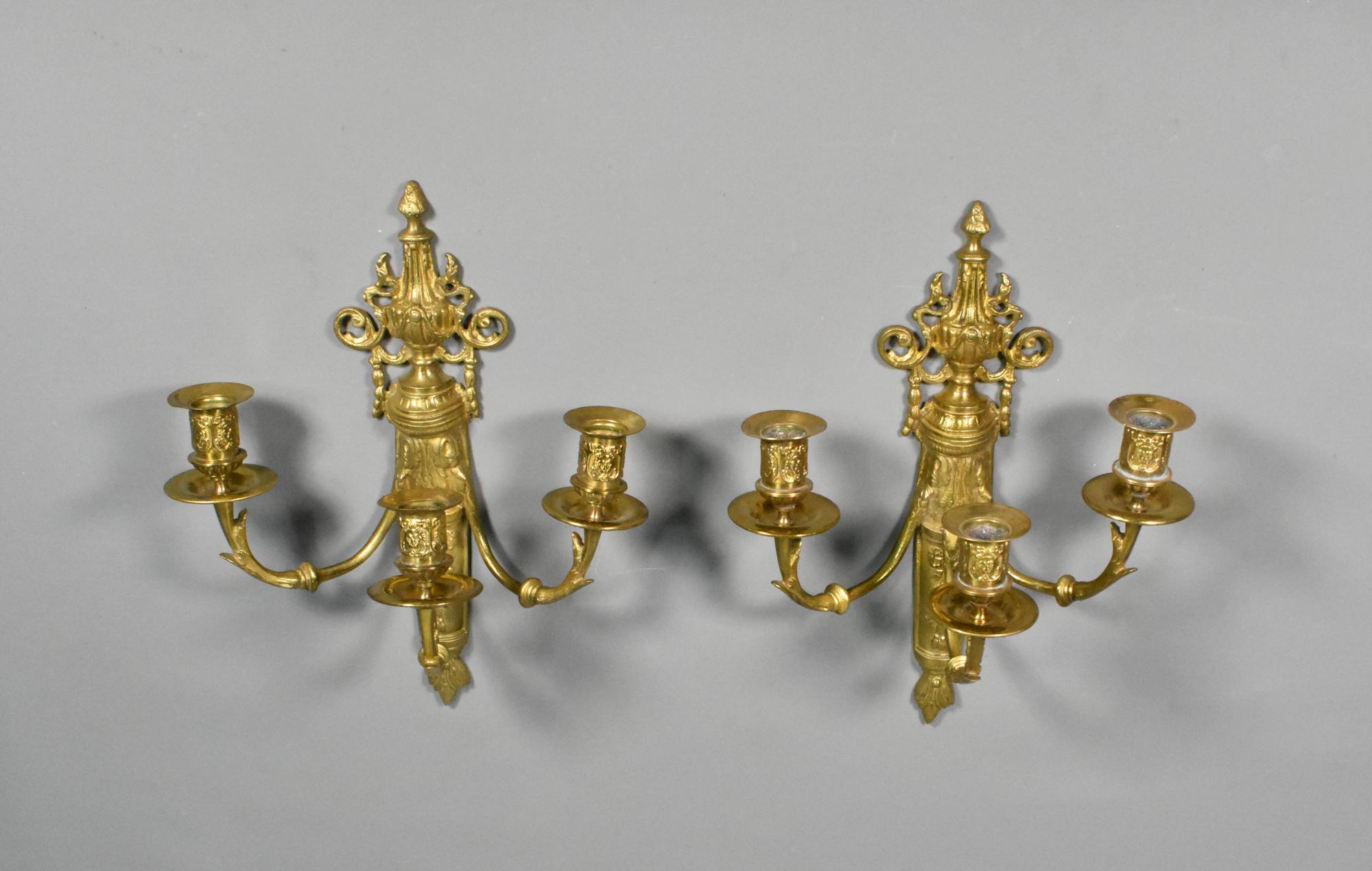 Pair French Gilt Bronze Wall Candelabra Louis XVI Style 

A matching pair of French Gilt Bronze Wall Candelabra featuring elegant swags, ribbons and floral motifs, characteristic of Louis XVI style decoration. 

From the central stem are three