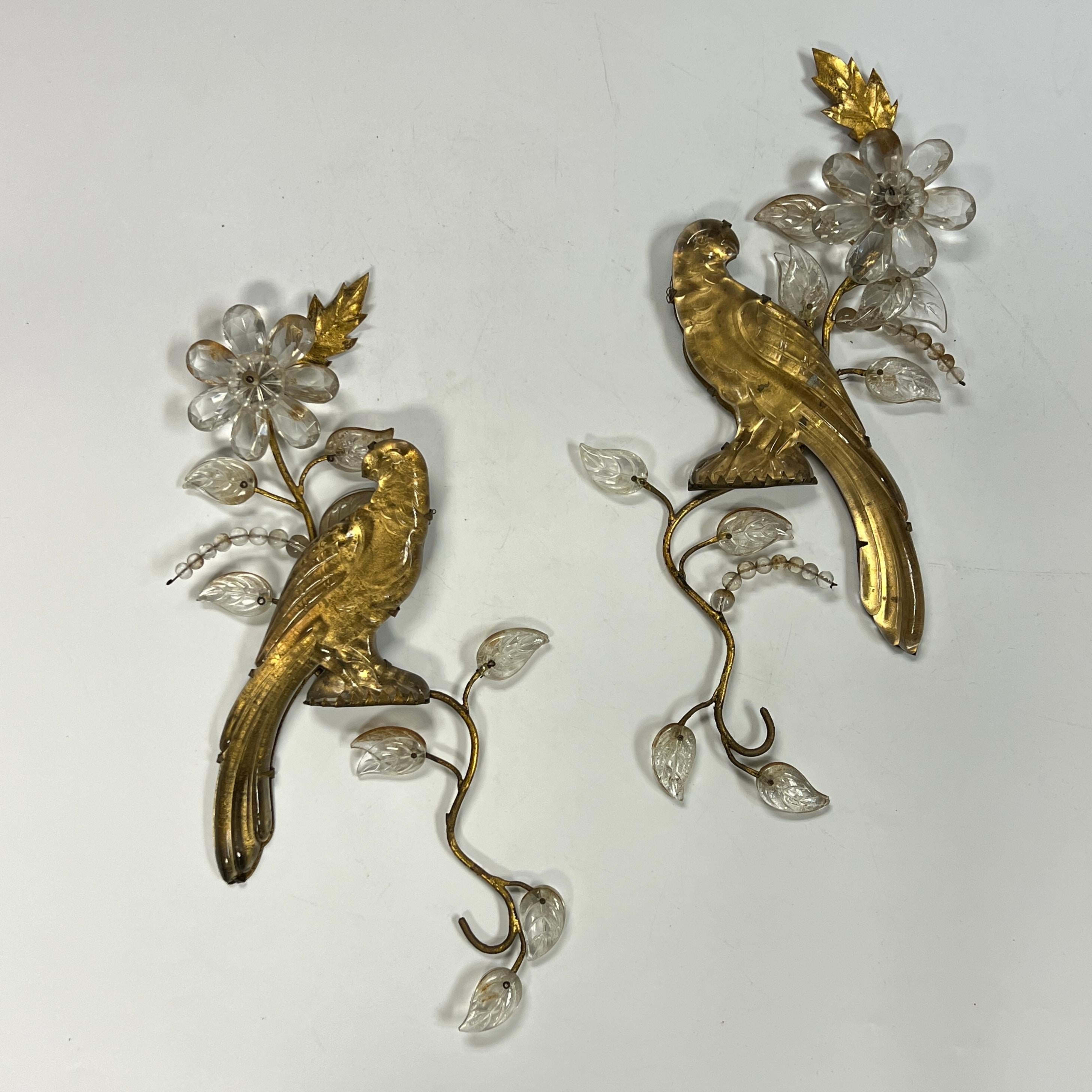 Pair of antique parrot-form wall appliques attributed to Maison Bagues, circa 1900-1910, crafted from gilt metal and glass, each 15 1/2 by 7 1/2 by 1 inches.