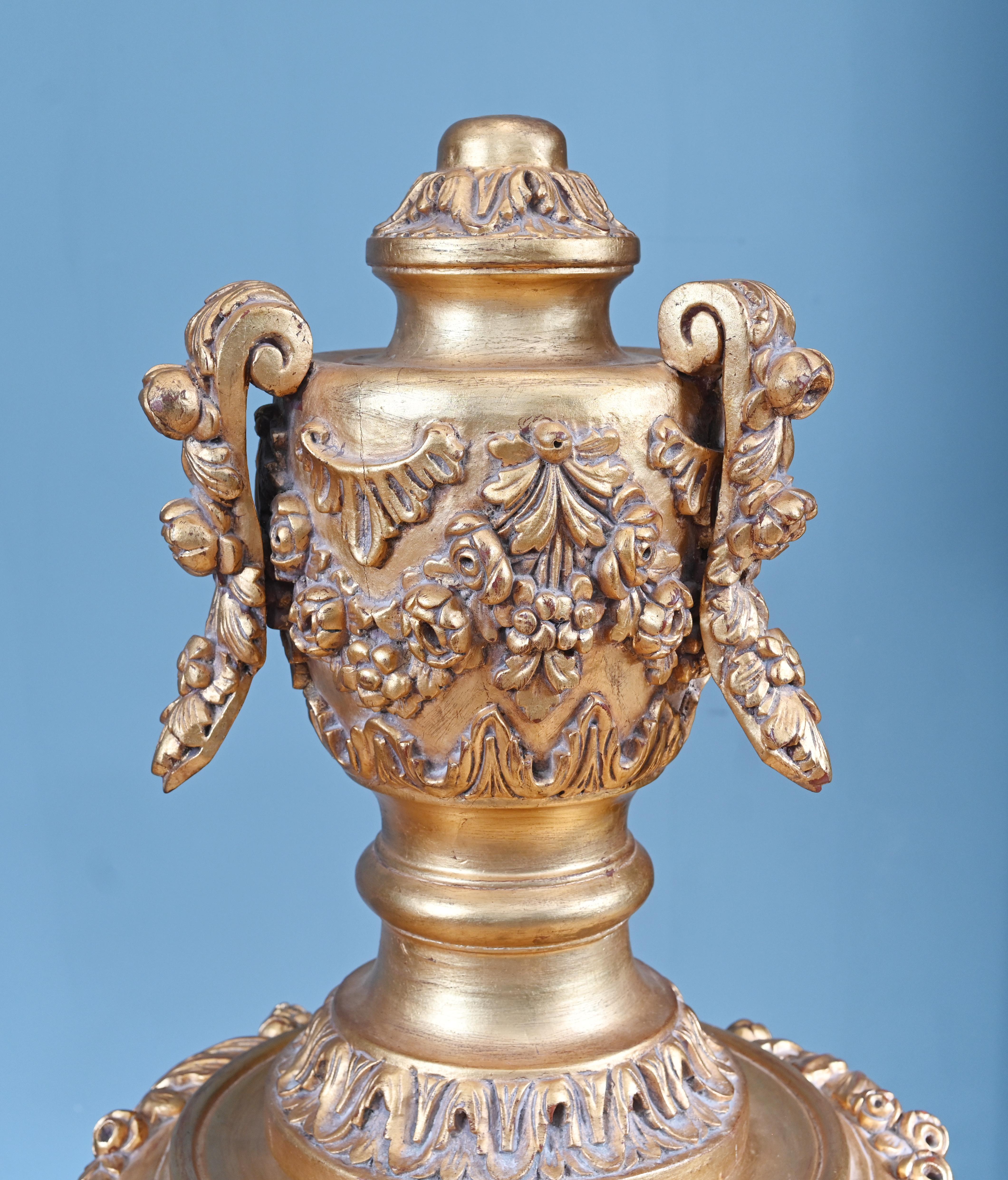 You are viewing a pair of Rococo French gilt pedestal stands Opulently hand carved with intricate Rococo designs
Each stand features a carved and gilded wooden base supported by three scrolled cabriole legs, richly adorned with floral motifs,