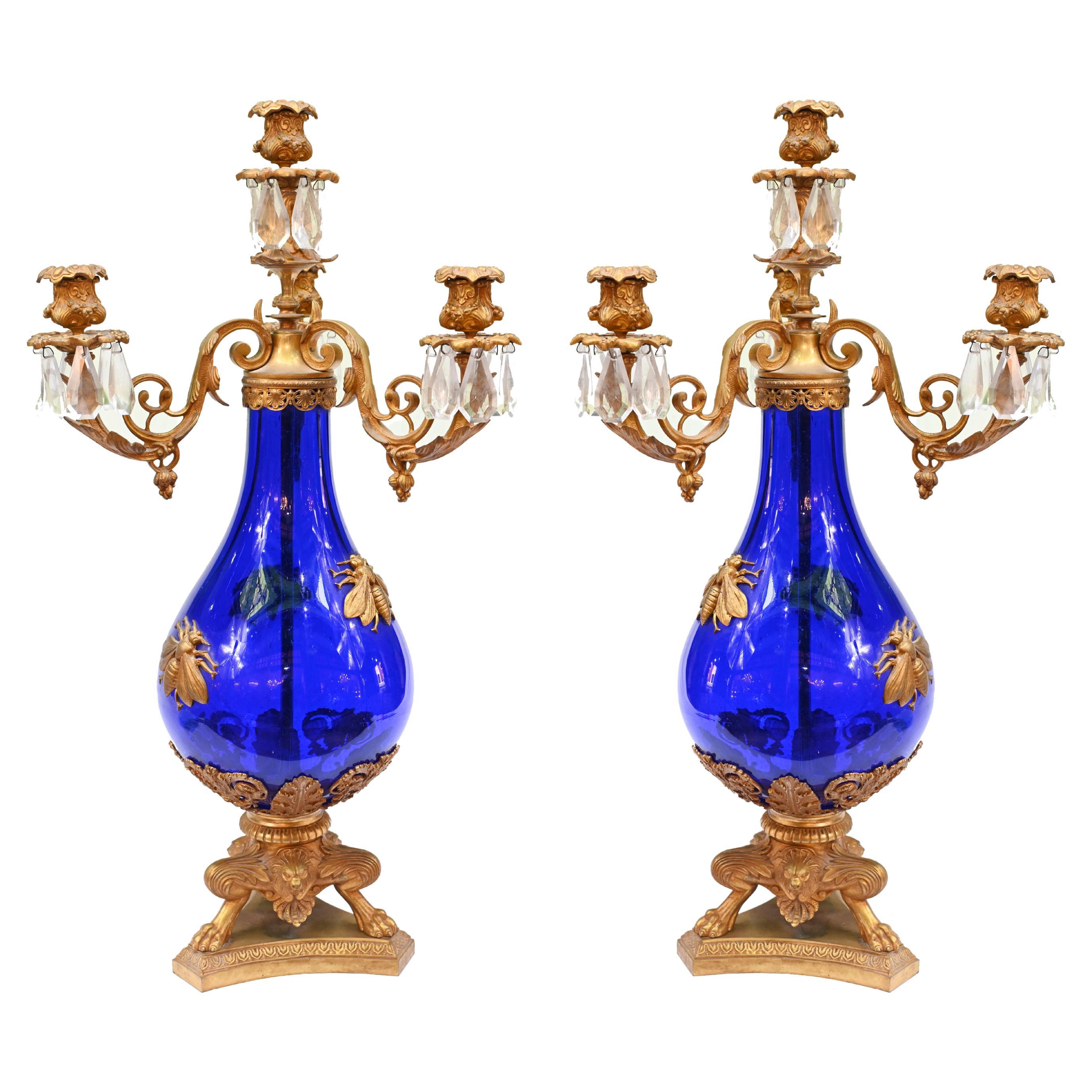Coppia di candelabri francesi in vetro con montatura dorata Impero 1870