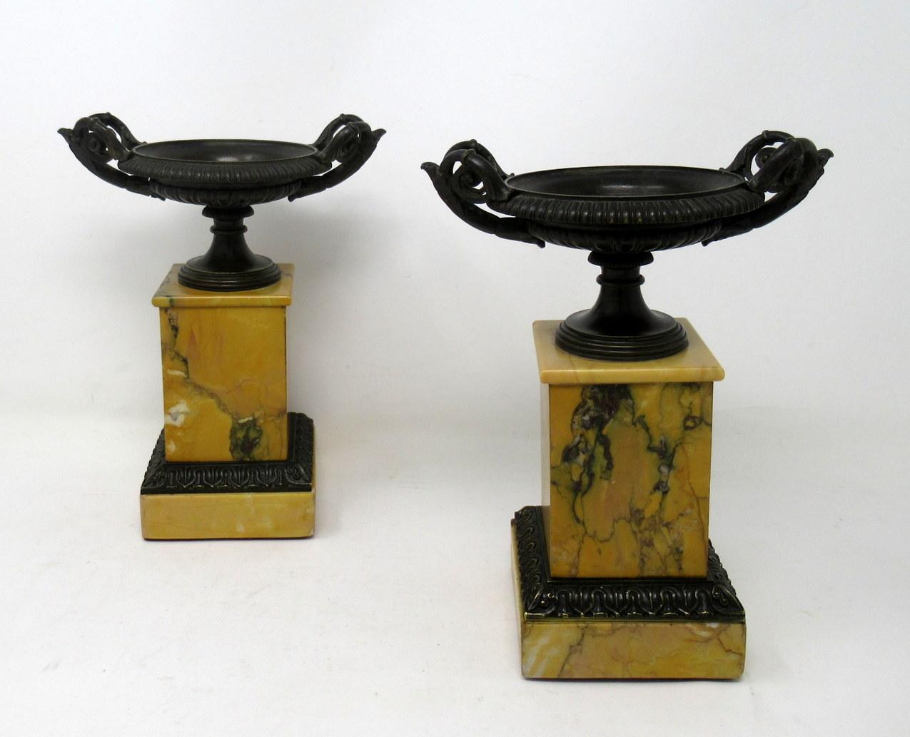 A very fine pair of French patinated bronze and well grained sienna marble grand tour twin handle tazza of compact and heavy proportions. First quarter of the 19th century, possibly Regency period. 

Each circular bowl with lobed reeded body and