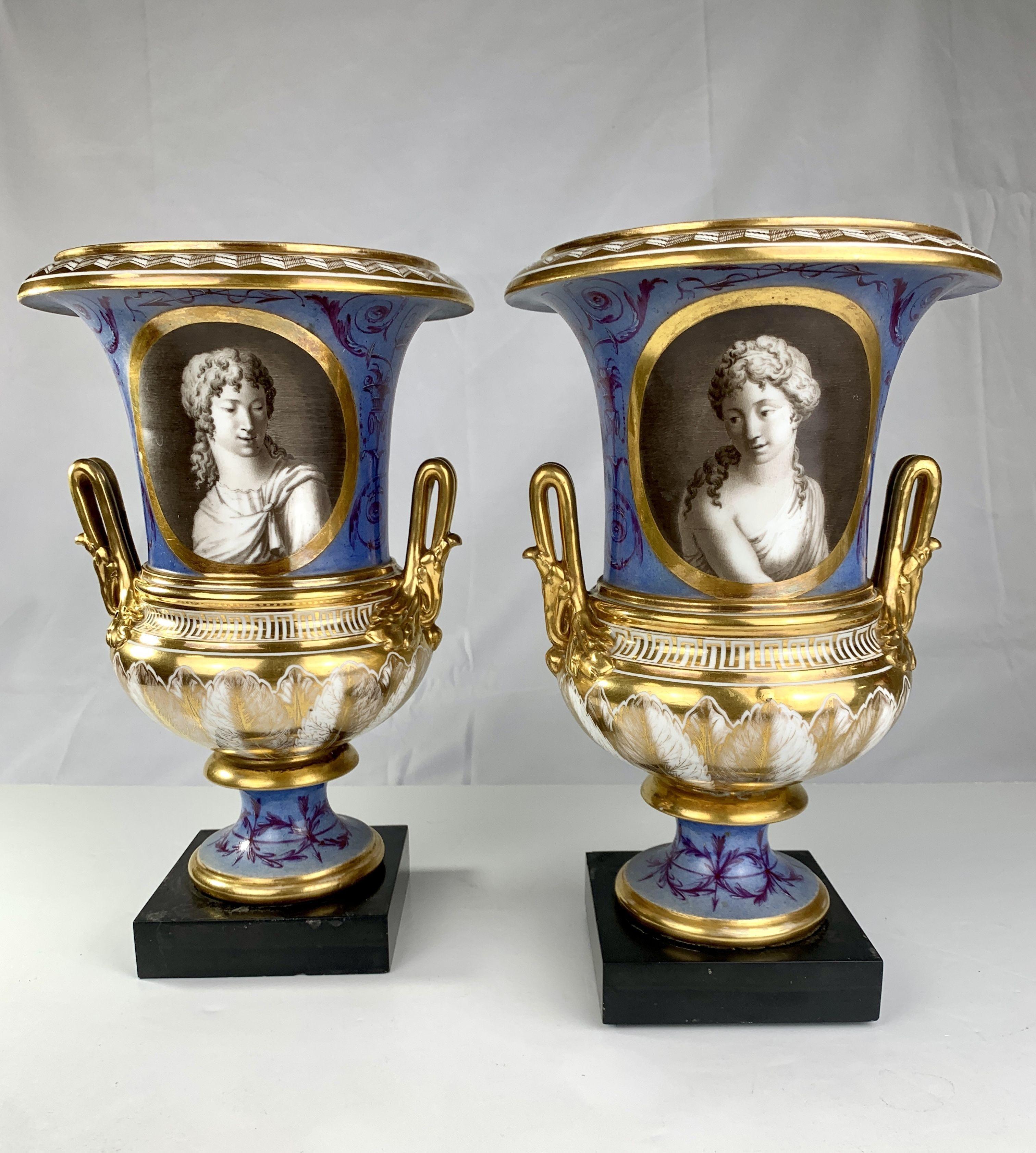 This pair of portrait vases with Roman figures was made in early 19th-century France. 
The exquisite execution of the classical portraits is immediately appealing. 
They connect with the viewer as if they were alive. 
Painted in grisaille and framed