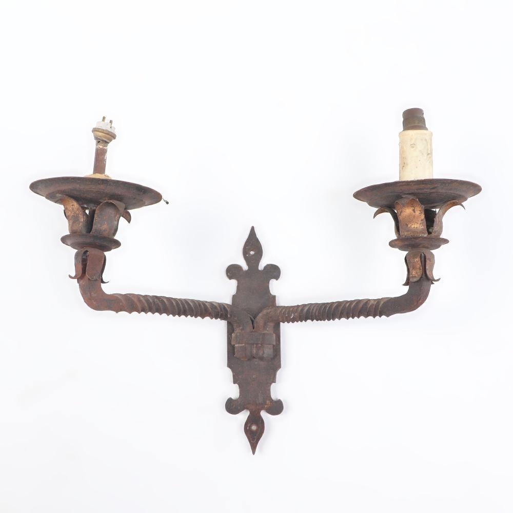 Iron Pair French iron two arm wall sconces with old traces of gold circa 1910 For Sale
