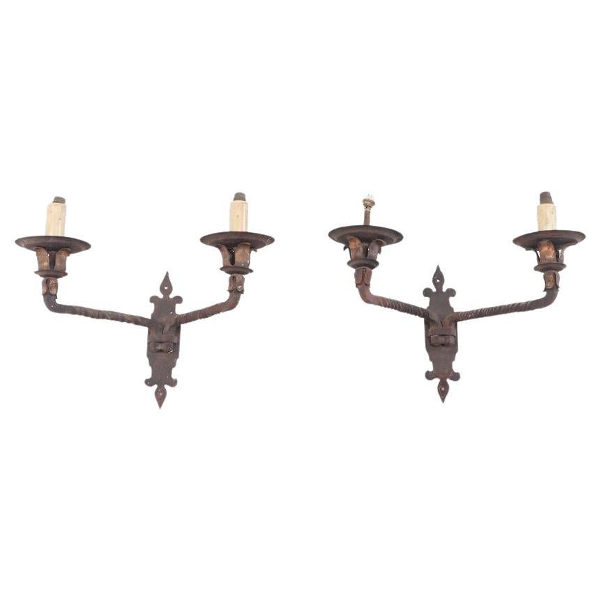 Pair French iron two arm wall sconces with old traces of gold circa 1910 For Sale