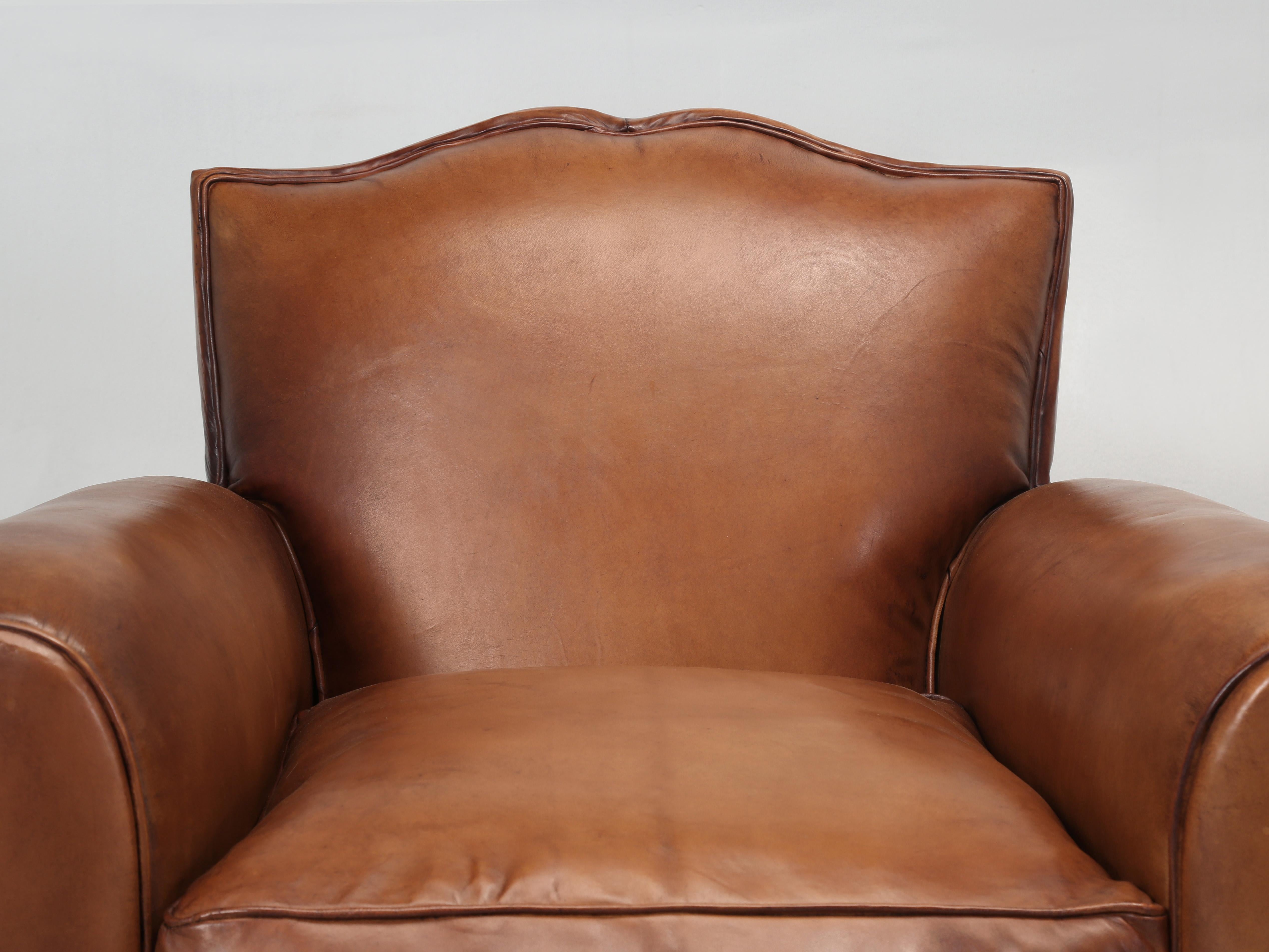 Pair French Leather Club Chairs Restored in France with New Leather. Now, normally this is where I would be telling you how our Old Plank Upholstery department completely disassembled the Club Chairs and rebuilt them from the frame up and tried to