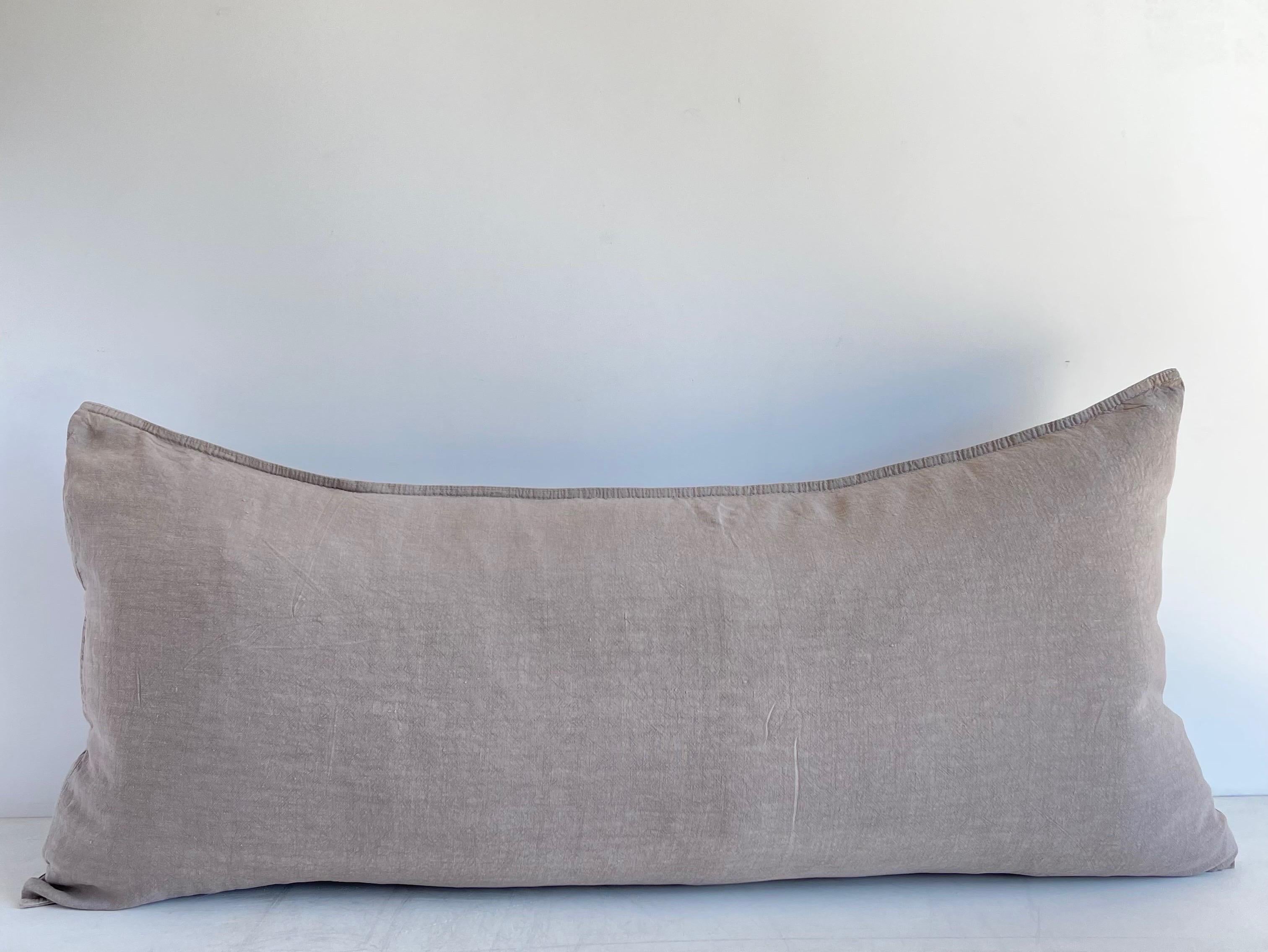Decorative Accent Pillow in a fine woven smooth soft linen.
Size: 16” x 32” when stuffed with insert. 
Can be used with a king size down insert.
Color: Natural with a slight Plum / Rose Hue.
Decorative Metal buttons at side.
This does not come