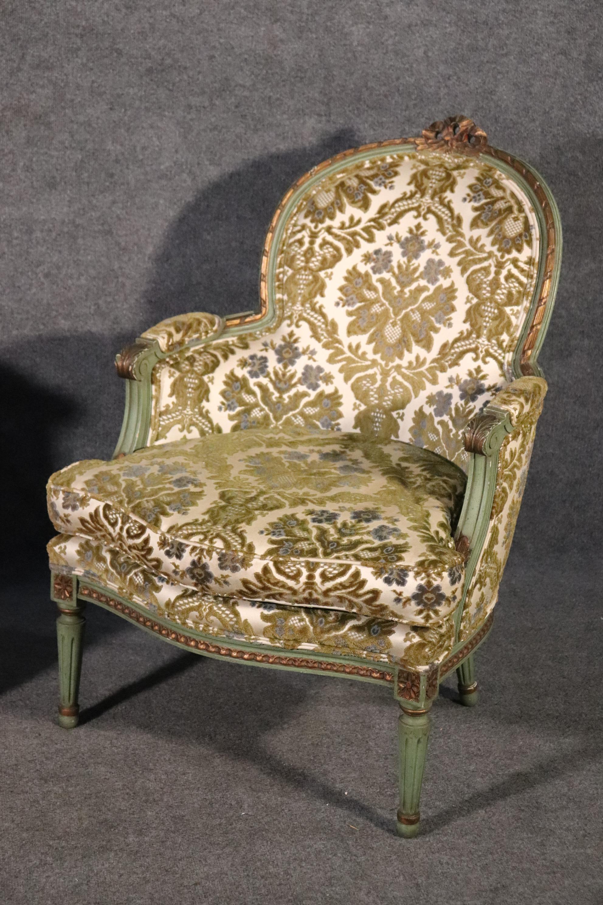 This is a gorgeous pair of French Louis XV bergeres with their original panited surfaces and upholstery. The chairs are in good condition and measure 38 tall x 27 wide x 29 deep deep and the seat height is 18 inches. The cushions will need the foam