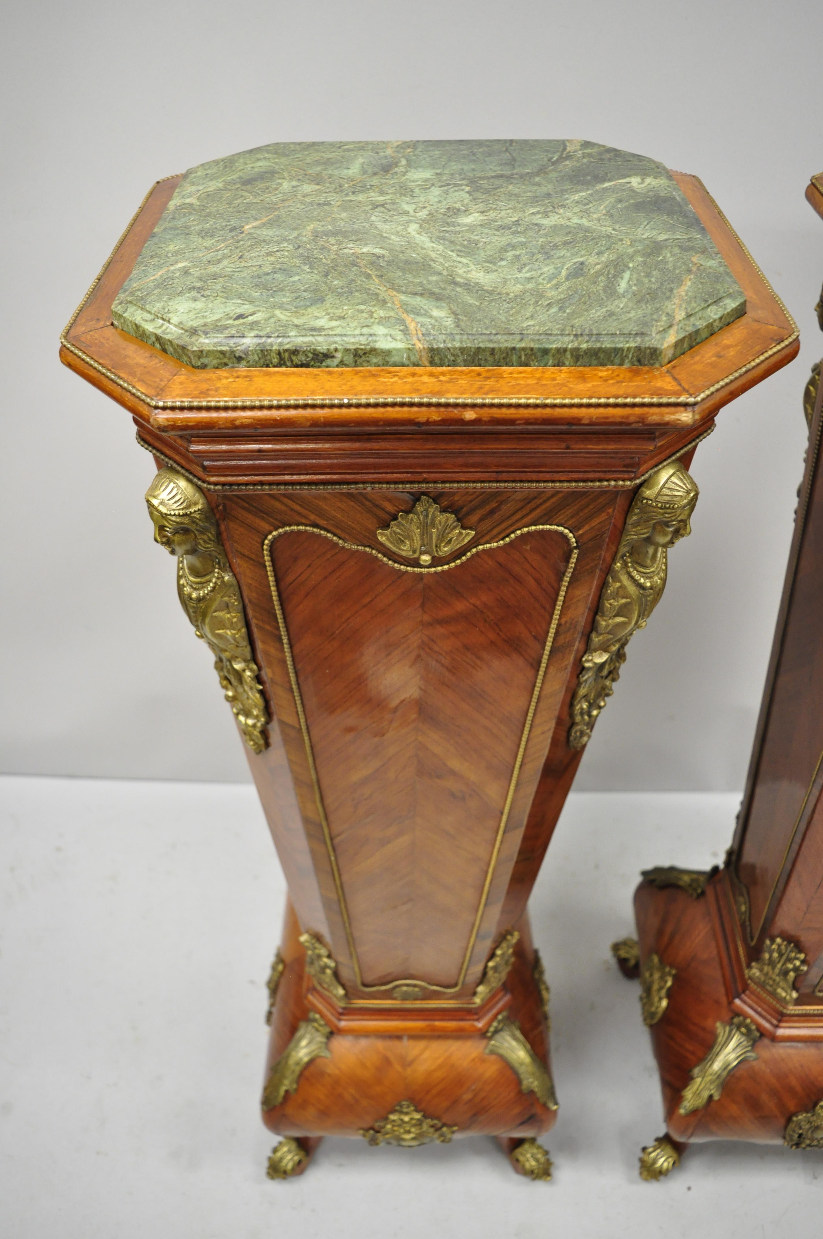 Pair of French Louis XV style marble-top bombe reproduction pedestal plant stands. Item features green marble tops, bronze figural ormolu, shapely bombe form, cabriole legs, great style and impressive appearance, circa late 20th century.