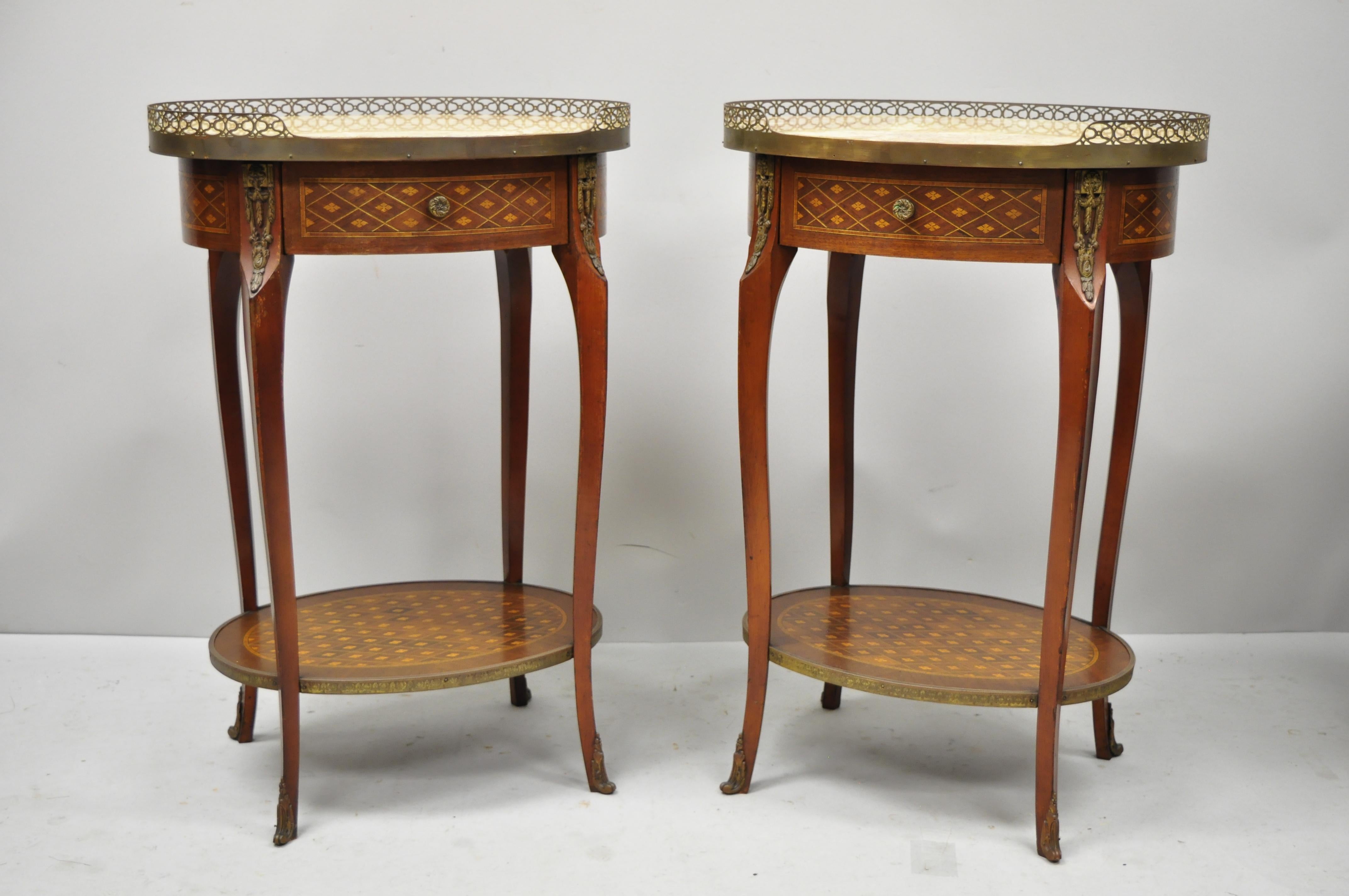 Pair of vintage French Louis XV style oval marble top Marquetry Inlay nightstands. Item features parquetry inlay, oval marble top, beautiful wood grain, finished back, 1 dovetailed drawer, cabriole legs, great style and form, circa early to mid-20th