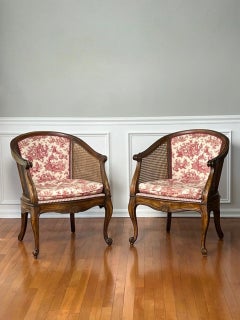 Pair French Louis XV Style Walnut and Cane Barrel Back Bergere Chairs in Toile