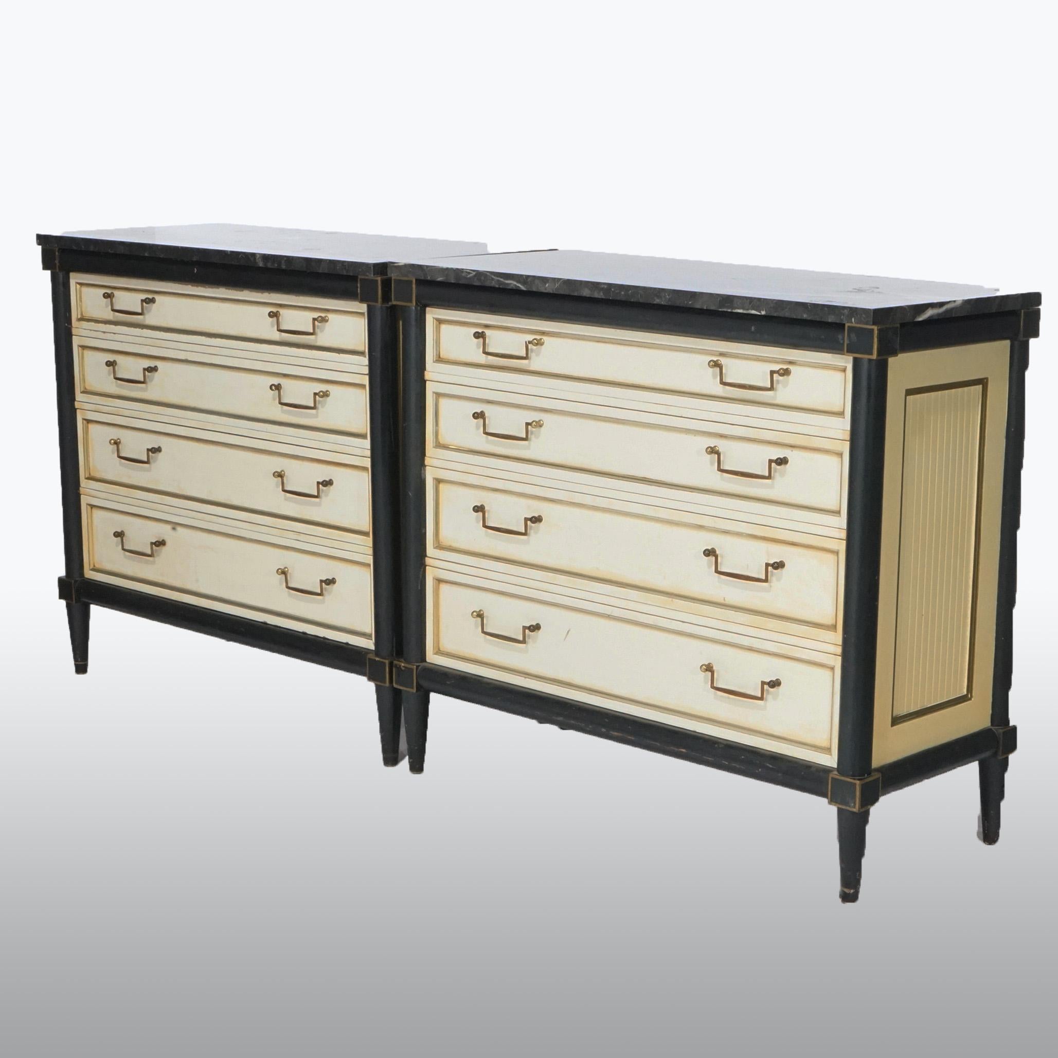 A matching set of French Louis XVI style commodes offer marble tops over chest with graduated drawers, ebonized frame and gilt highlights, raised on turned tapered legs, 20th century

Measures- 31.75''H x 36.25''W x 16''D.