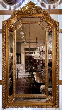 Pair French Louis XVI Style Paneled and Beveled Gold Mirrors.