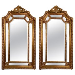 Pair French Louis XVI Style Paneled and Beveled Gold Mirrors.
