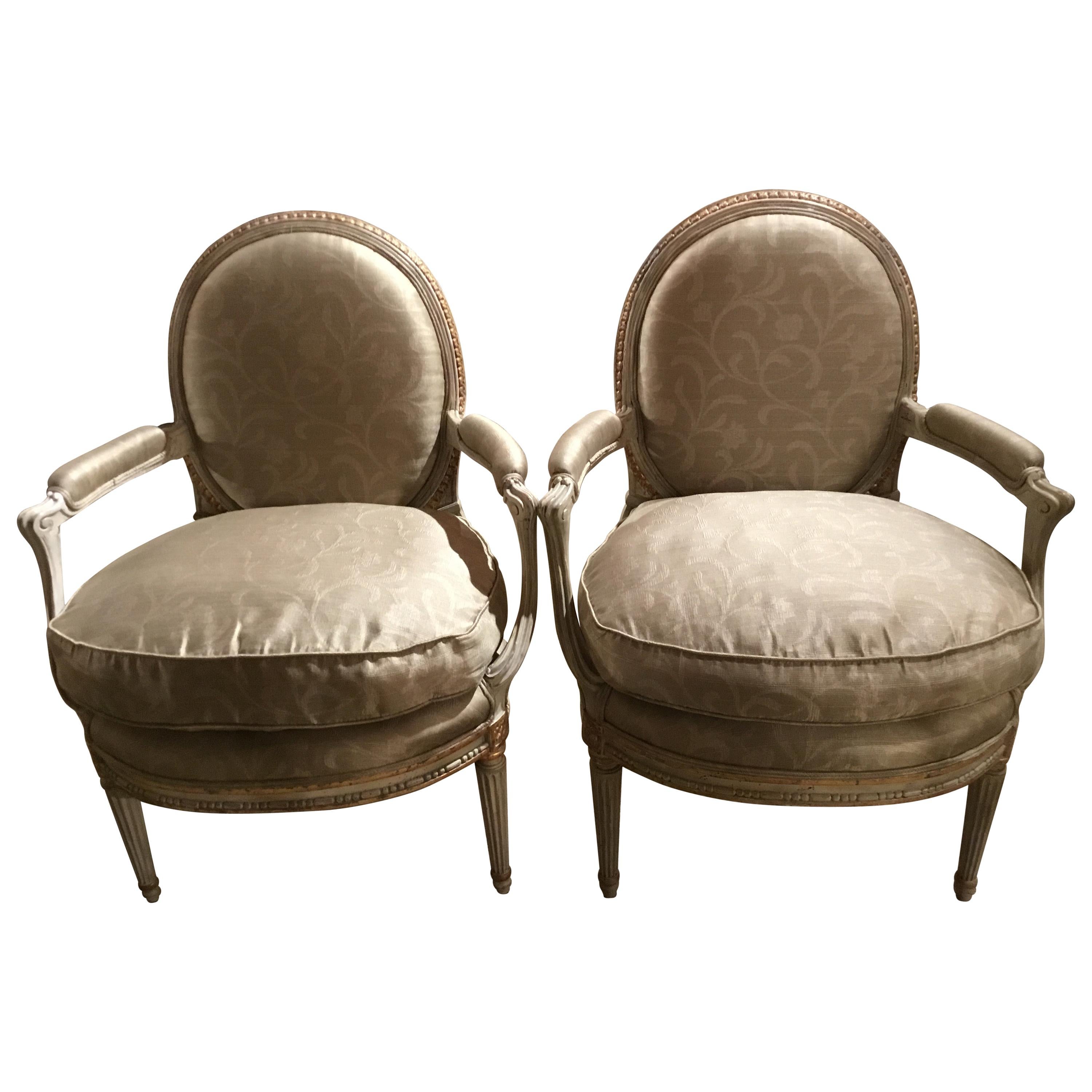Pair of French Louis XVI Style Parcel Paint and Parcel-Gilt Chairs/Fauteuils For Sale